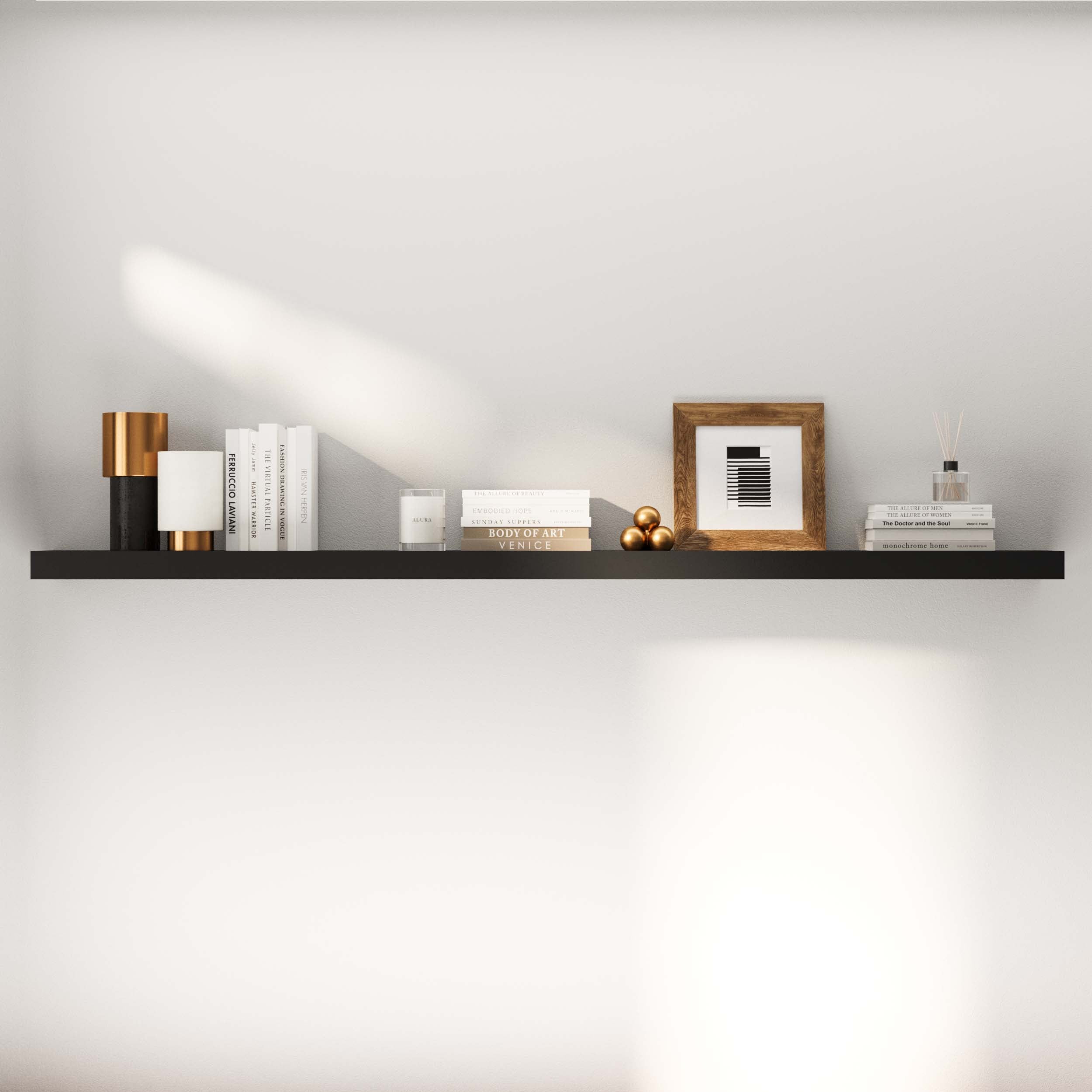 Wide view of a black floating shelf against a wall, decorated with books, candles, and a photo frame, emphasizing its stylish, versatile look.