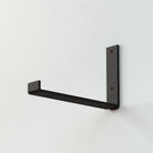 Single metal shelf bracket for secure and modern wall shelving, ideal for home organization.