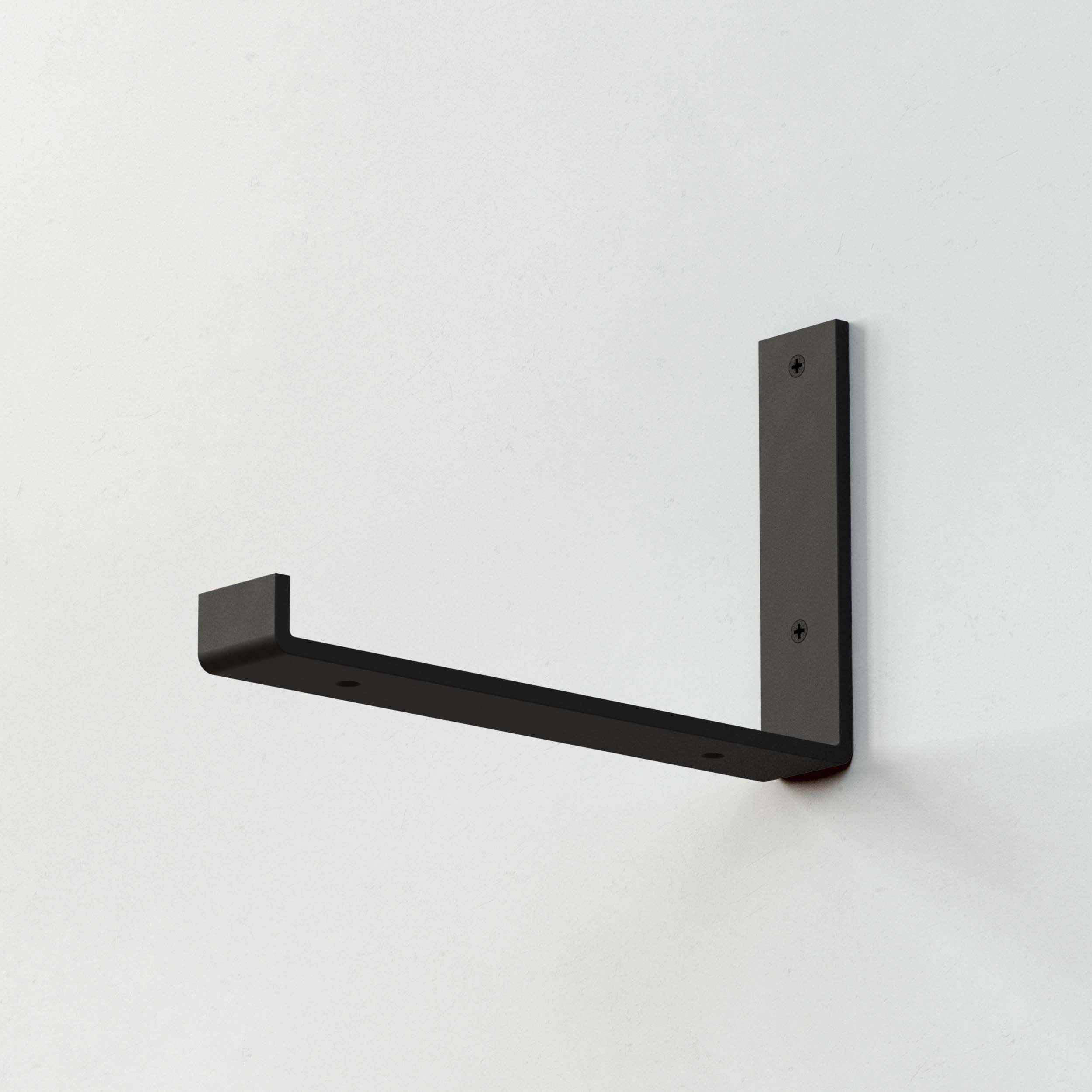 Single metal shelf bracket for secure and modern wall shelving, ideal for home organization.