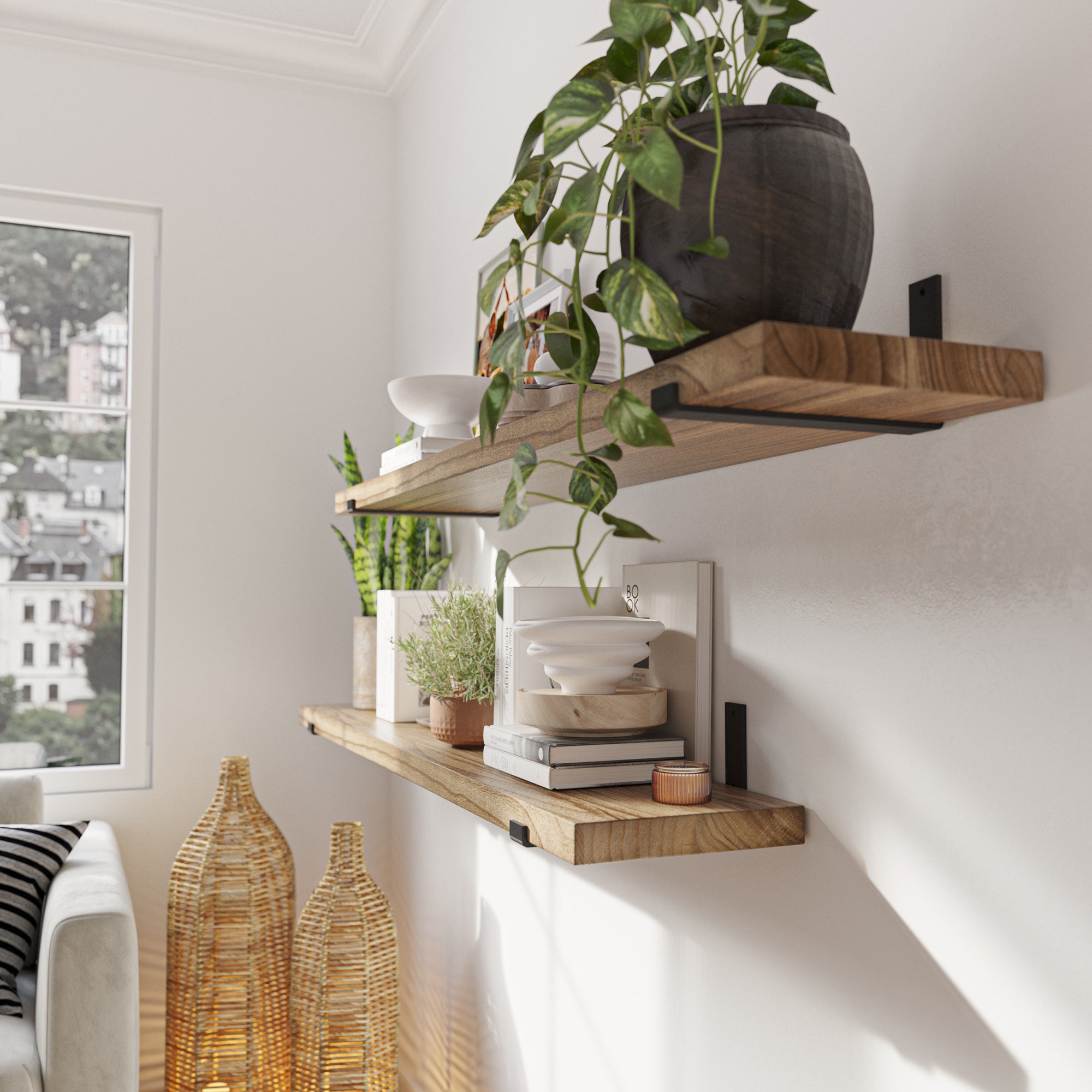 Side view of a living room with wooden shelves and black metal brackets, showing décor elements.