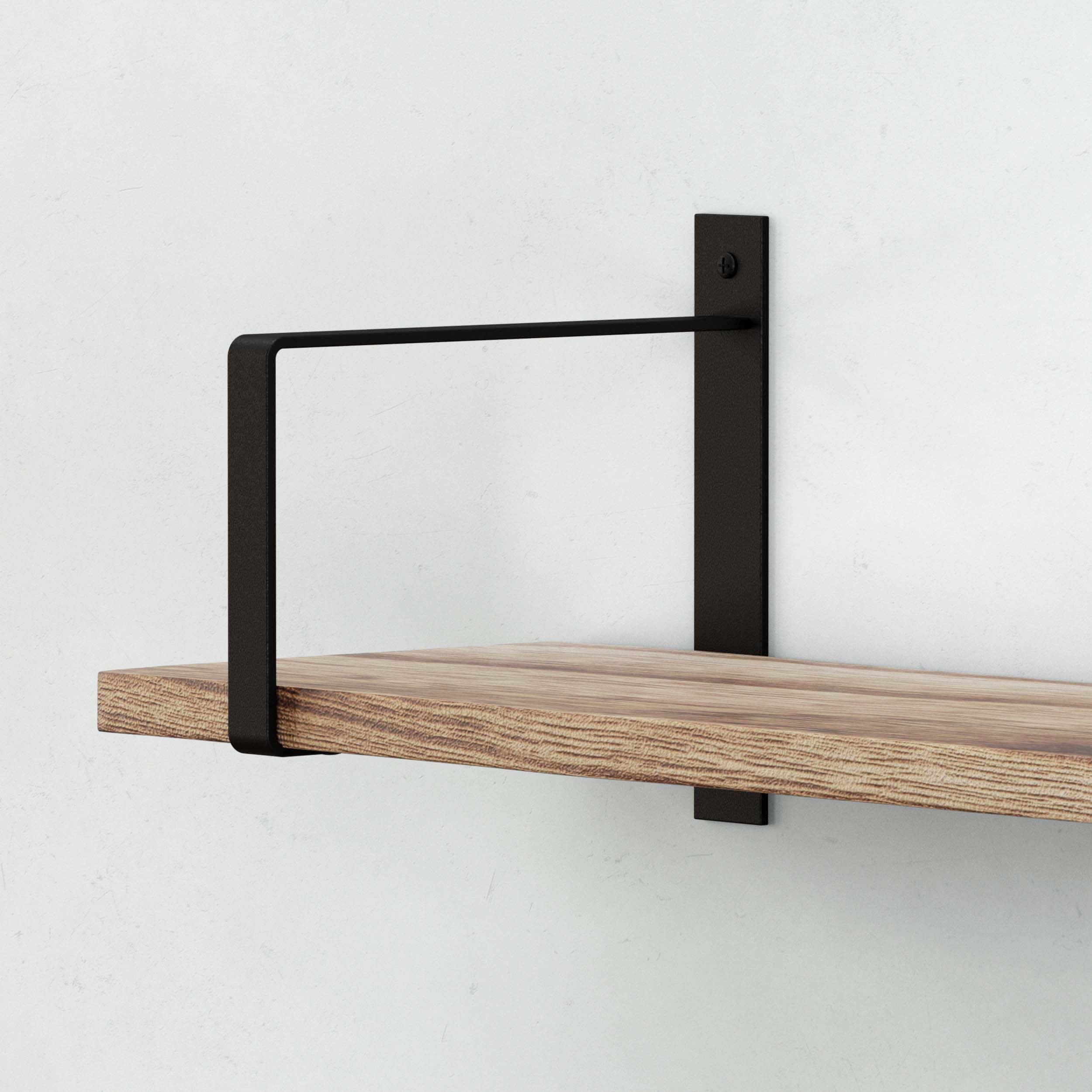 Black rectangular mounting bracket supporting a wooden shelf, mounted on a wall.