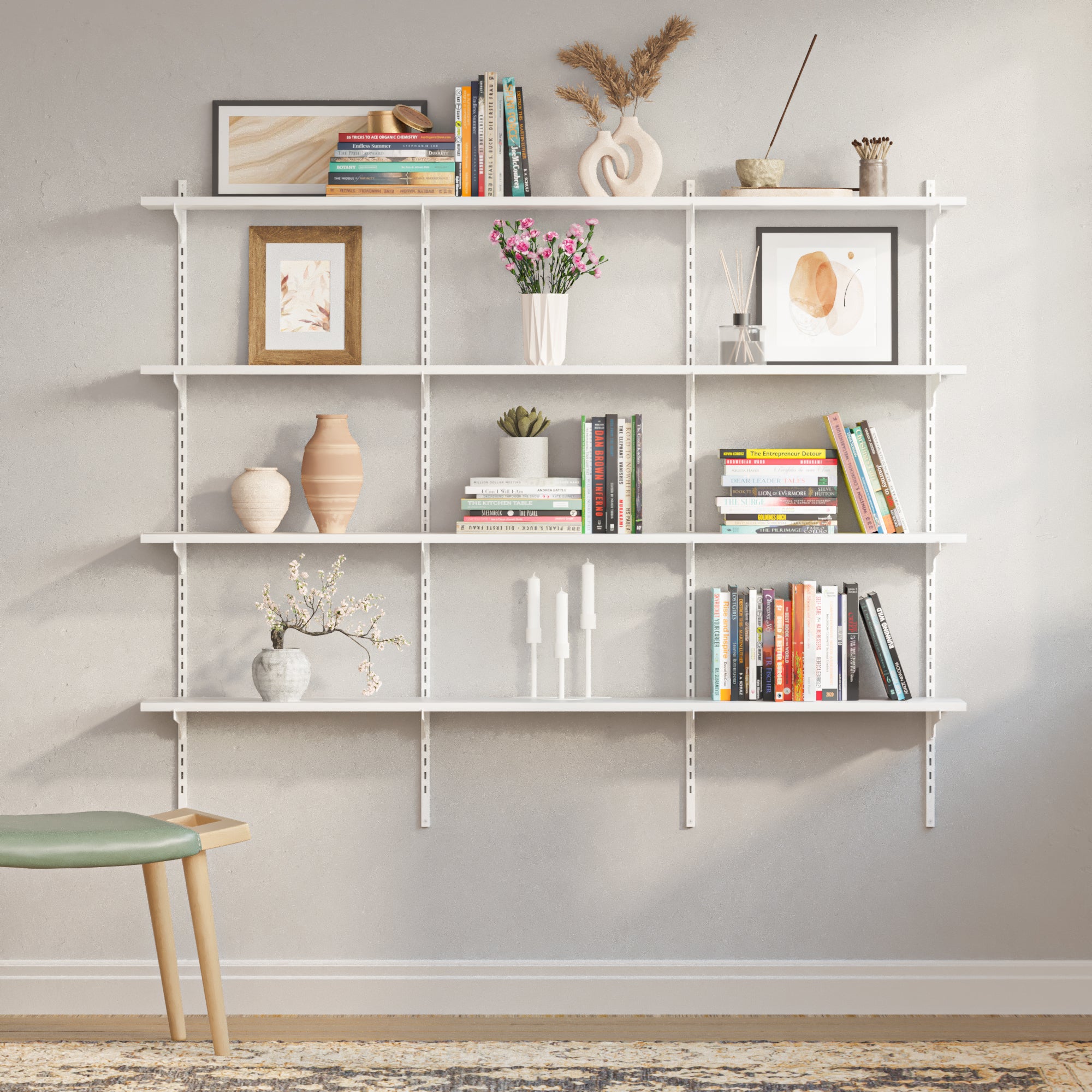 A clean, empty 4-tier wall-mounted shelving unit with white metal rails and adjustable brackets, ready to be customized for books, decor, or storage