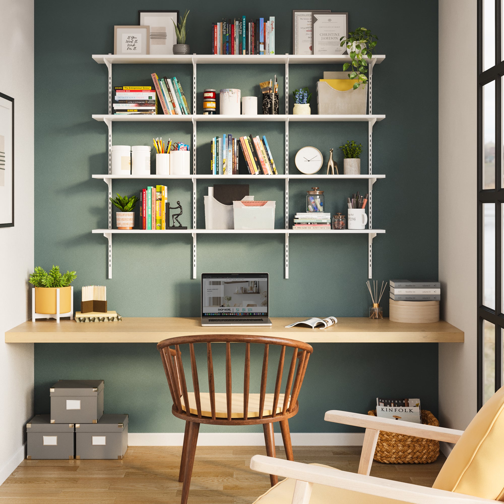 A cozy green wall with a 4-tier white office shelving unit with adjust brackets setup holding books, decor, and greenery. Perfect above a sofa or for home library setups.
