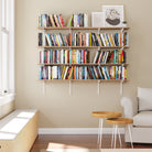 A cozy living room setting, the wooden shelf’s ability to organize large book collections stylishly—blending with both classic and modern interiors.
