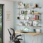 A bright home office scene shows the TURIN 4 tiered long wooden shelf holding books, décor, and frames—making it ideal as an office shelf to improve organization and elevate your workspace.