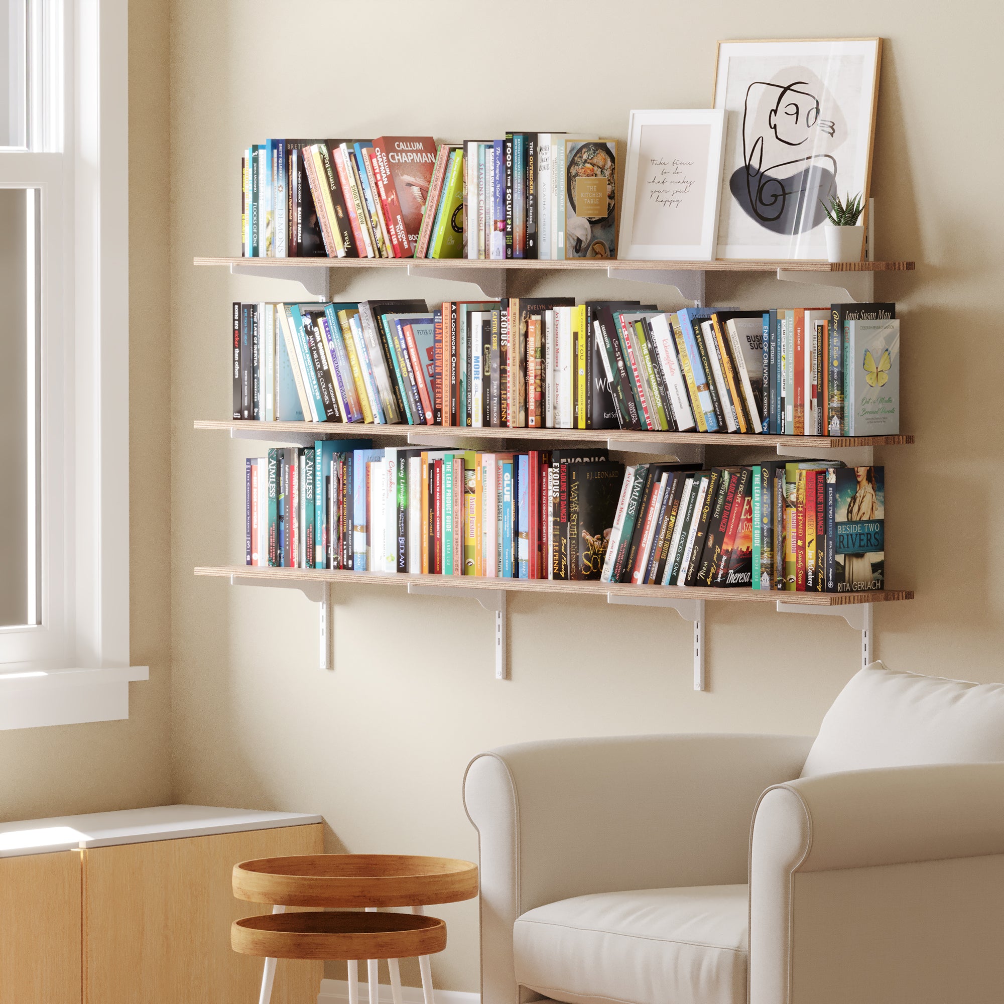 60 inch long farmhouse  shelf used as a home library in a cozy reading nook. Demonstrates how the 60” wall bookshelf can accommodate a large book collection with style and efficiency.