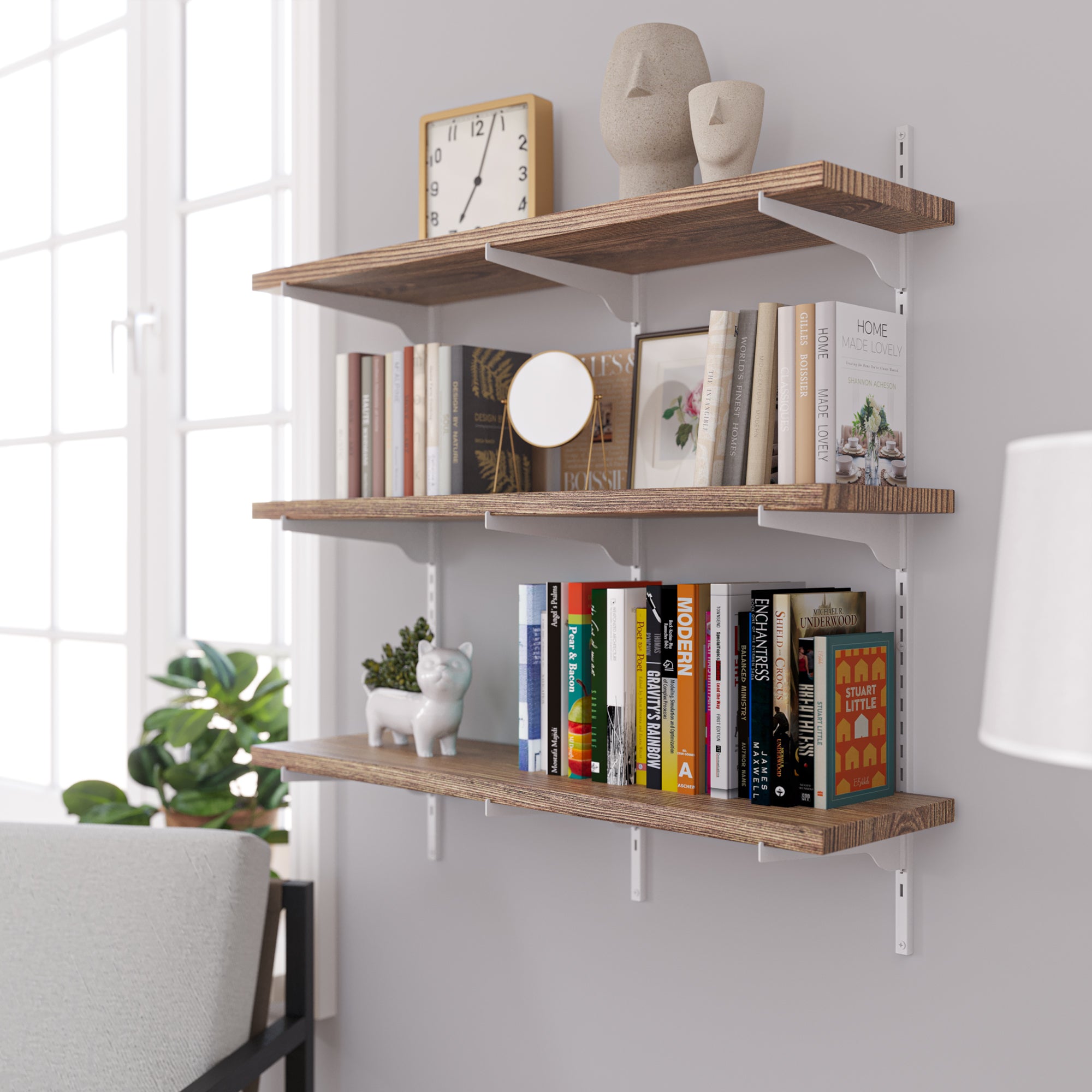 Floating wall book shelves with books and decorative items against a white wall.