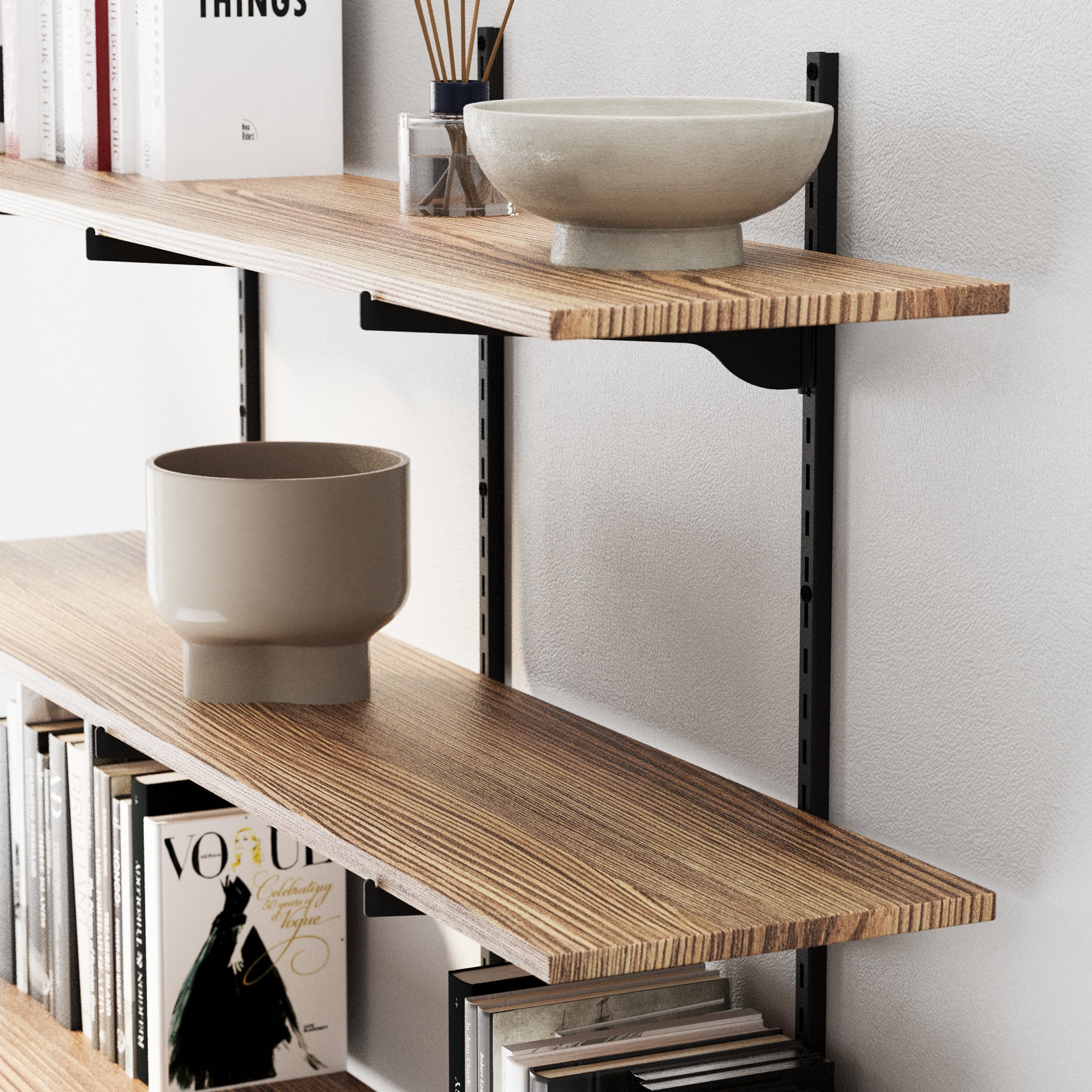 Real wood shelves with books and decorative bowls against a white wall