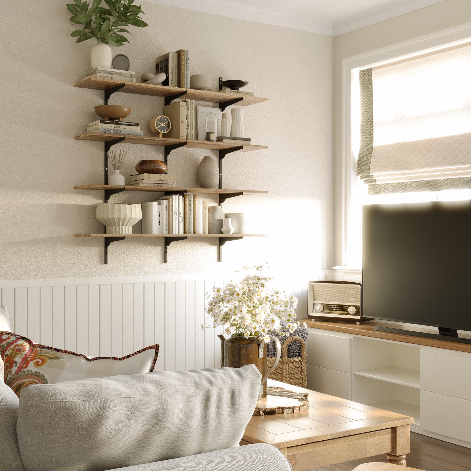 Living room with a floating wood shelves for living room decor, sofa, coffee table, and television.