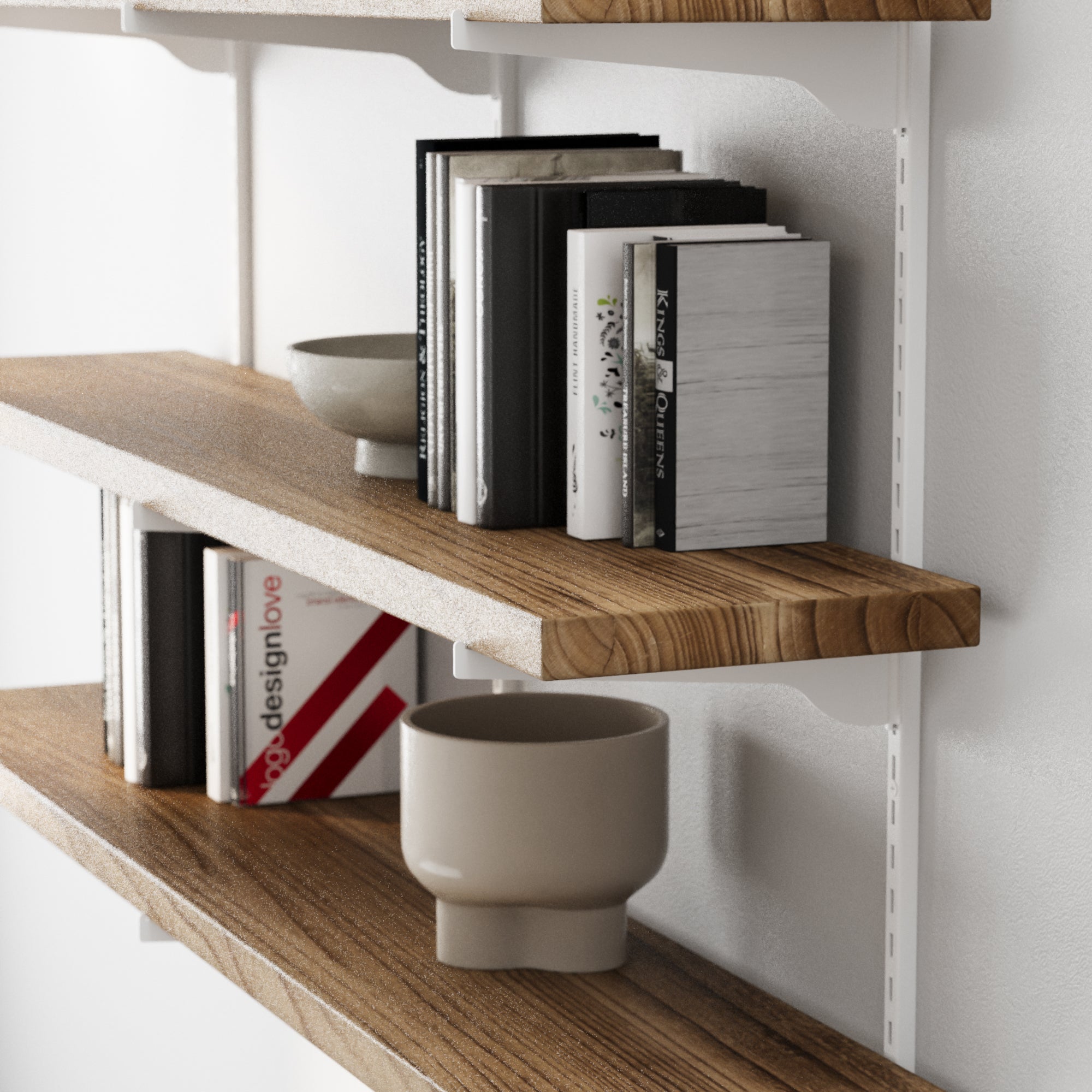 Wood collectibles shelves with books and decorative items against a white wall