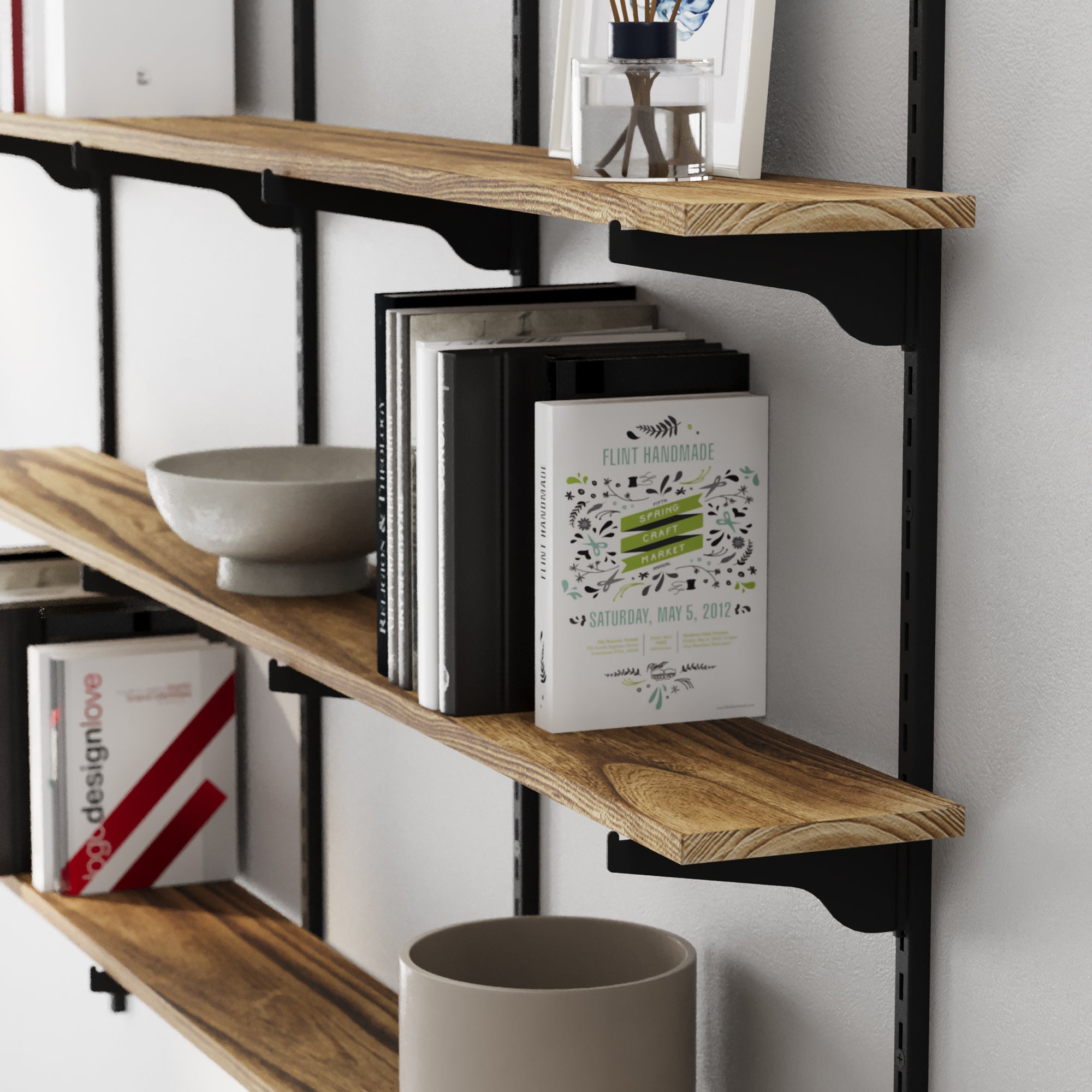 Long floating shelves with books and decor items against a white wall