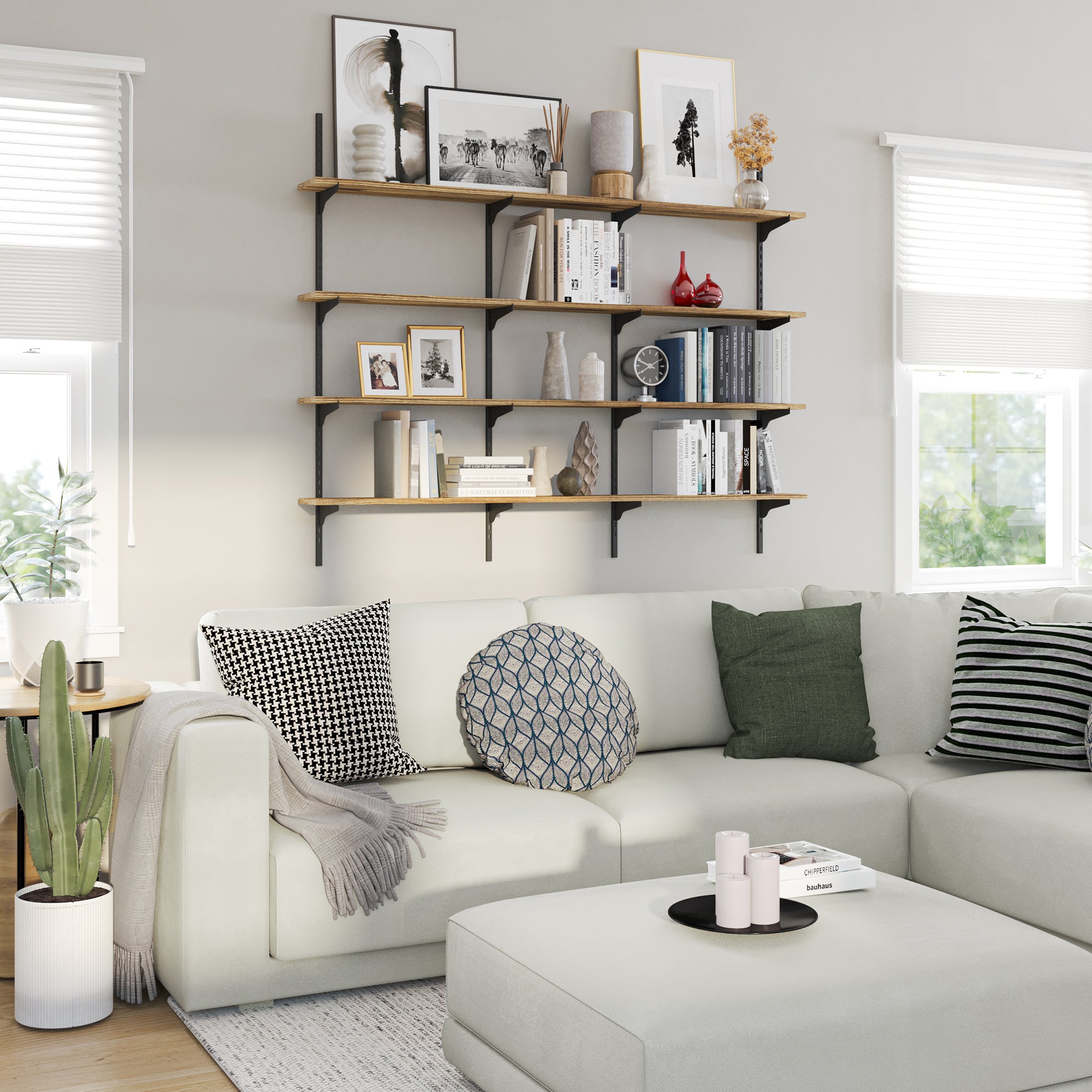 Modern living room with a white sofa, decorative pillows, and a living room bookshelf.