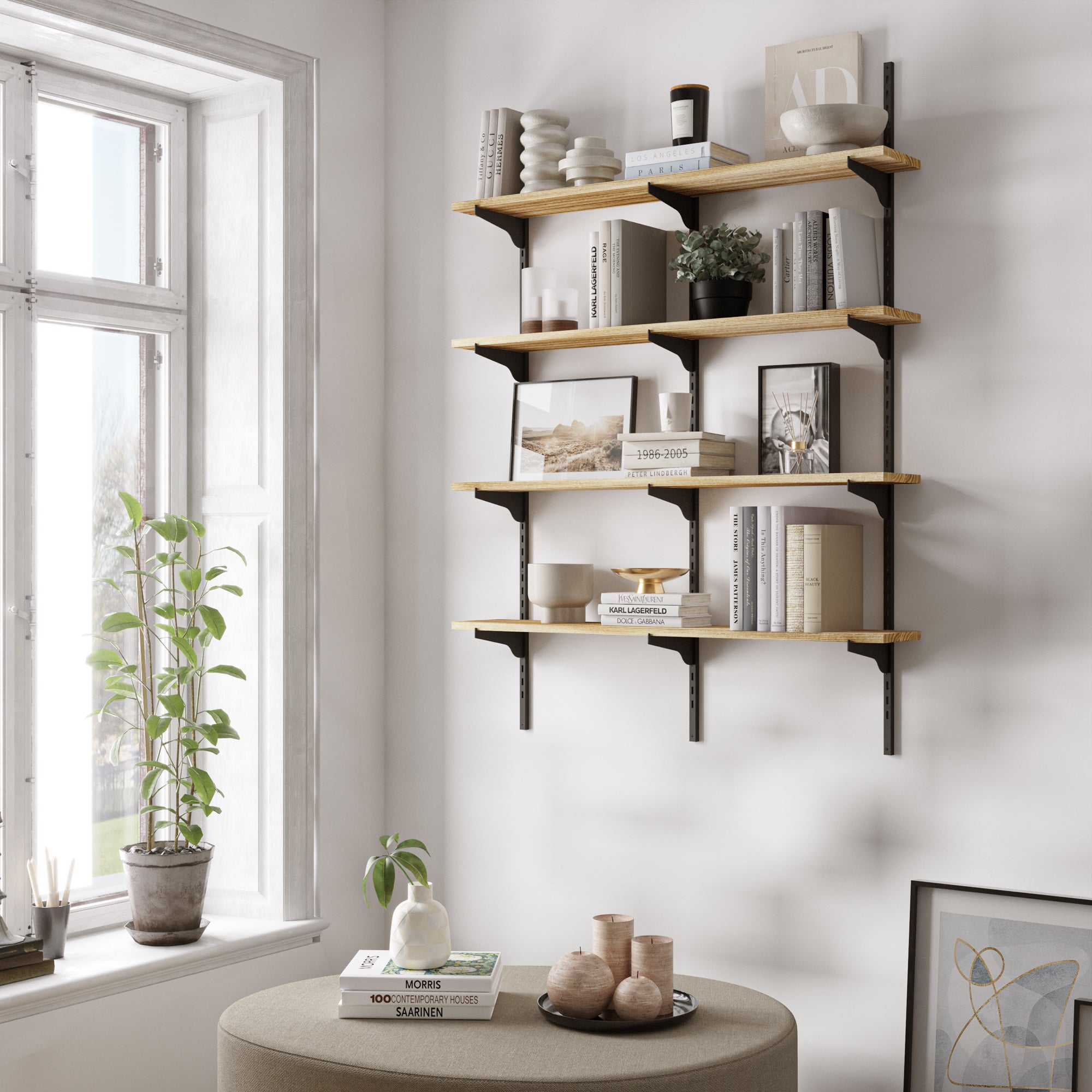 Bright, airy living room featuring a 4-tier shelving unit with wood boards and black brackets, styled with neutral-toned decor, books, and plants near a large window.
