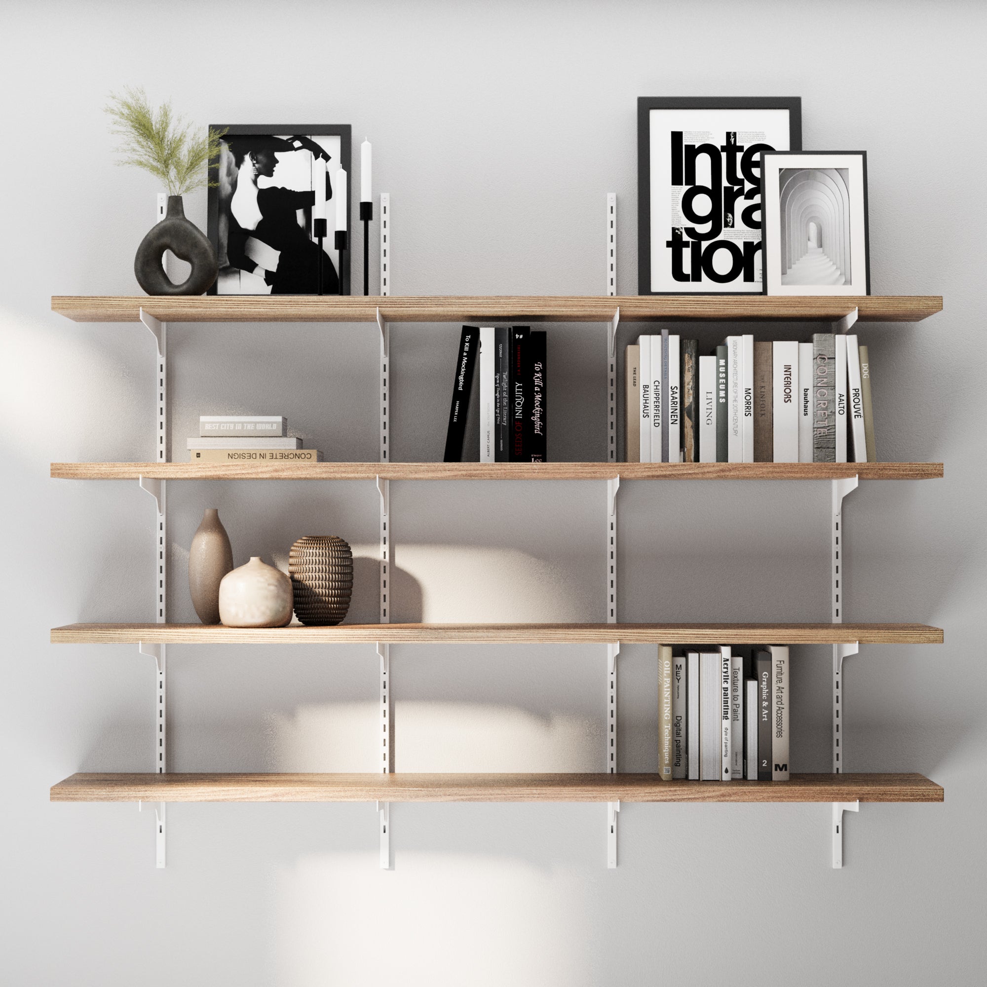 60 inch long floating shelving unit for wall with books, decorative items, and framed pictures against a white wall.
