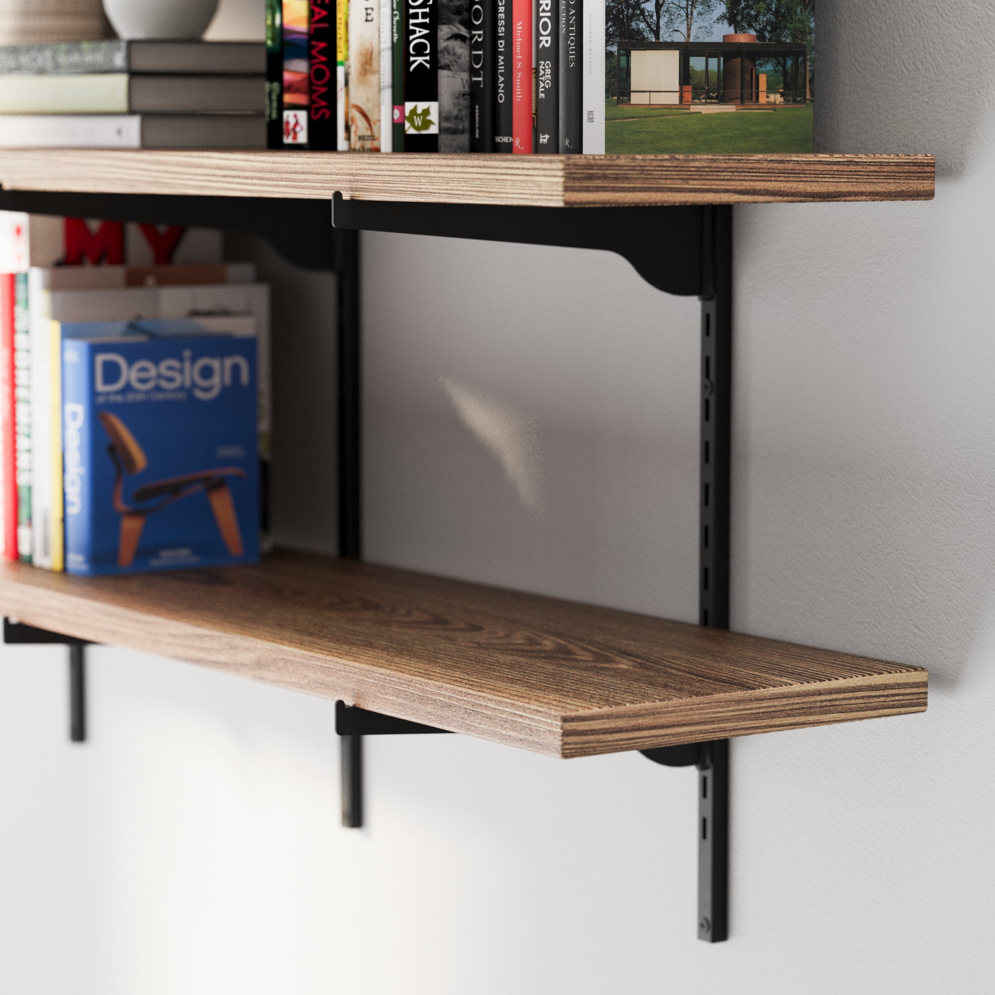 A rich wood grain board and black metal bracket, showing the slim profile, sturdy support, and neatly arranged books.