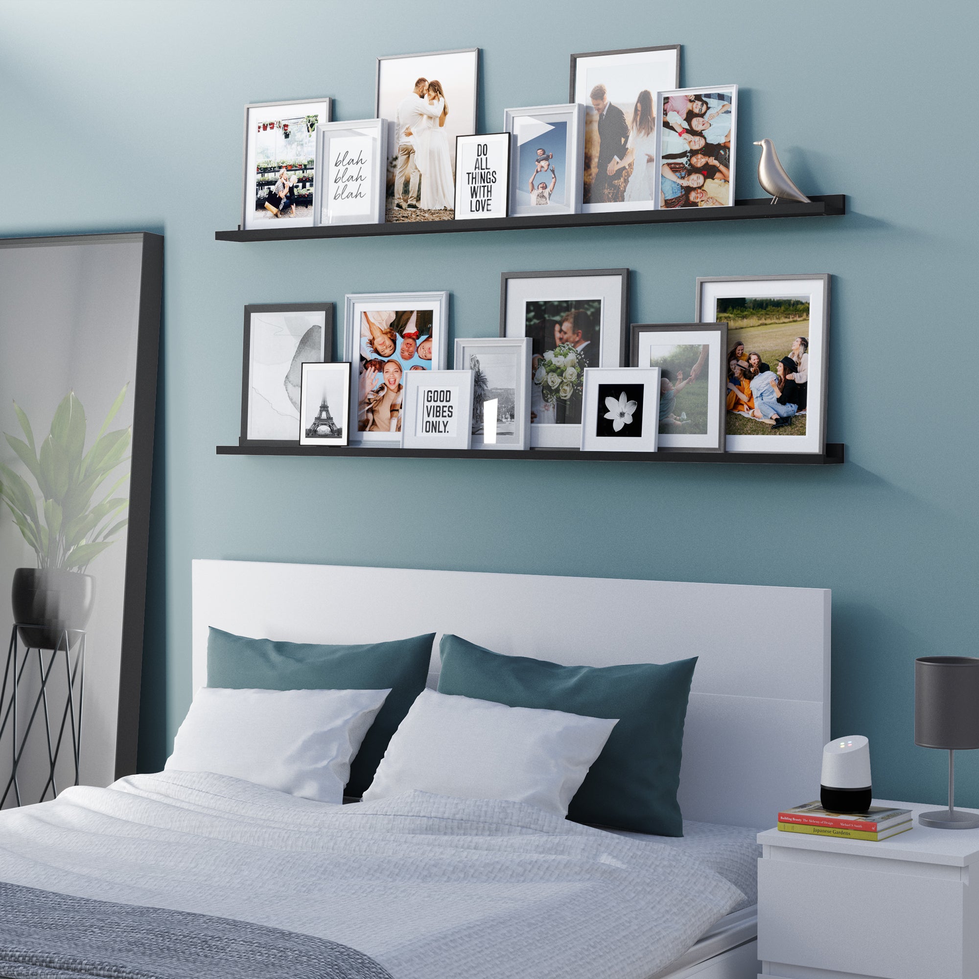 Bedroom with pictures on two black bedroom shelves above the bed.