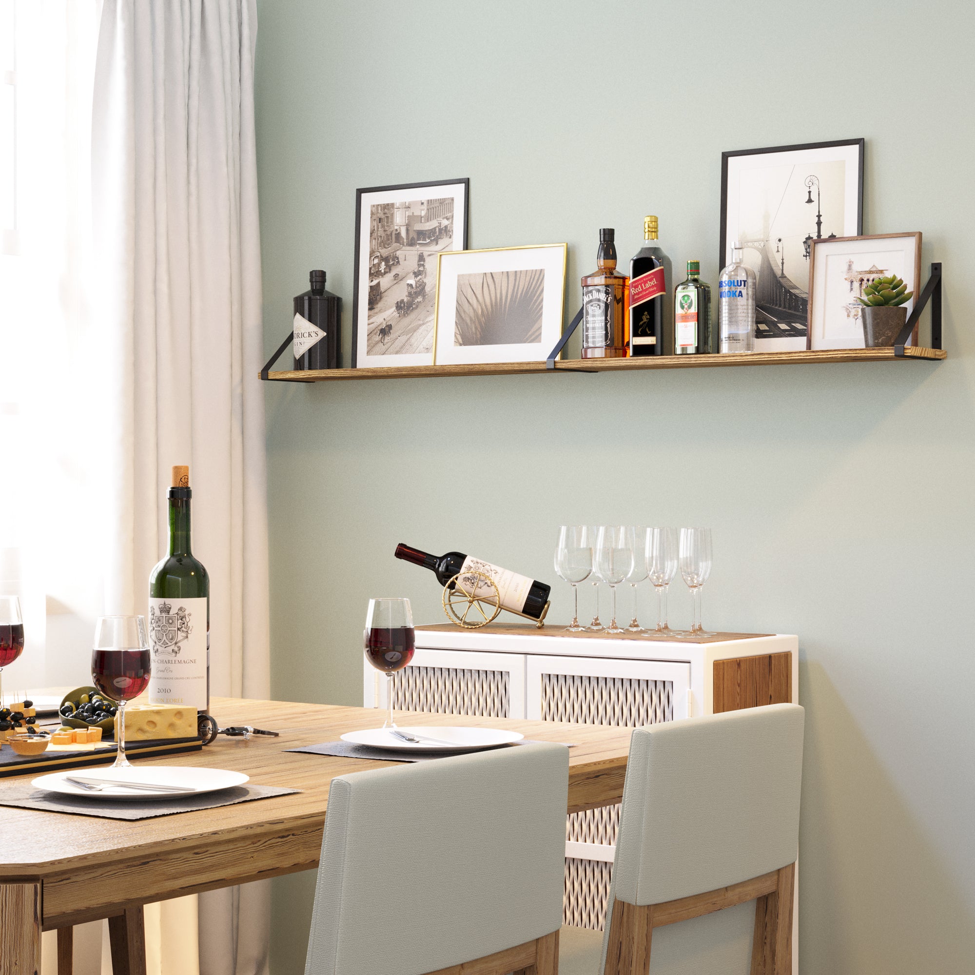A cozy dining space with a wooden table, chairs, a wall storage shelf with liquor and decor, and a sideboard with wine glasses.