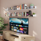 Media room setup with white dislplay shelves displaying DVDs and decor above a TV console, perfect for organizing entertainment essentials with style.