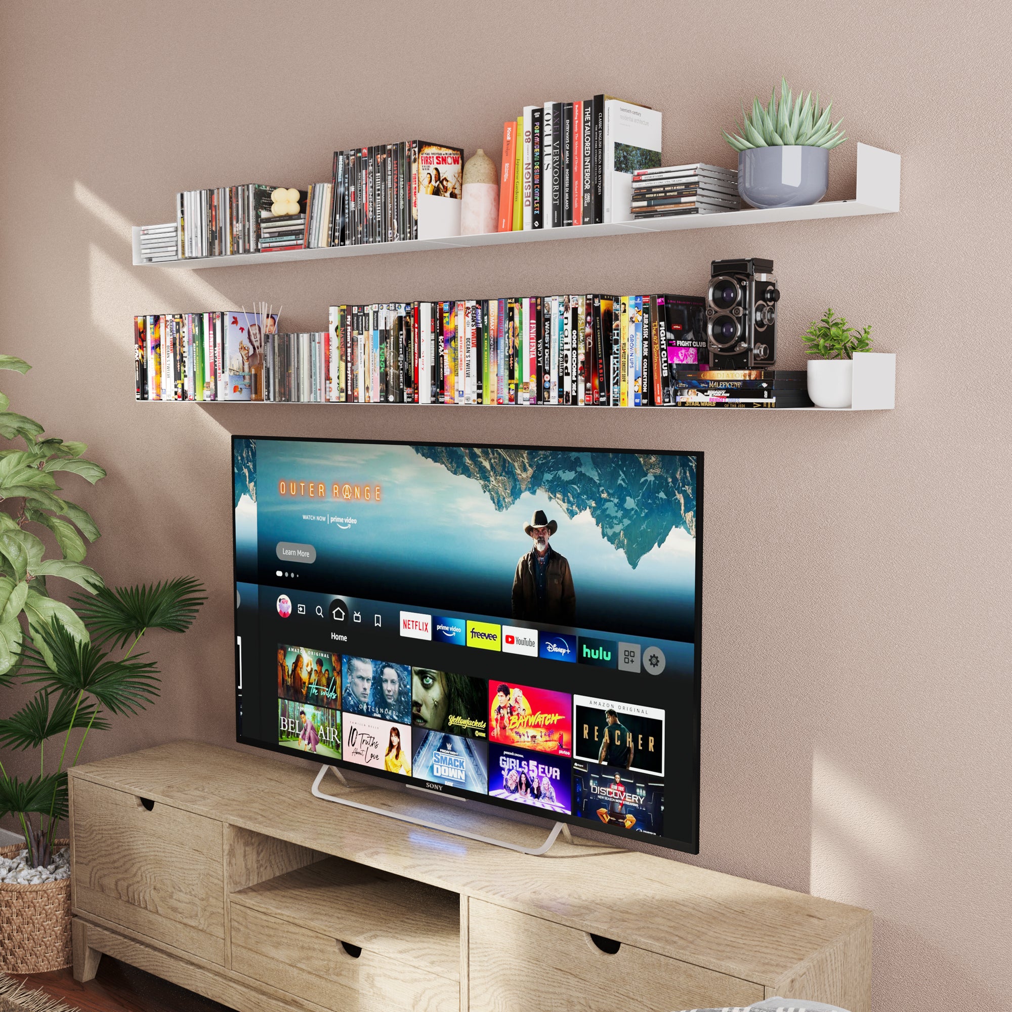 Media room setup with white dislplay shelves displaying DVDs and decor above a TV console, perfect for organizing entertainment essentials with style.