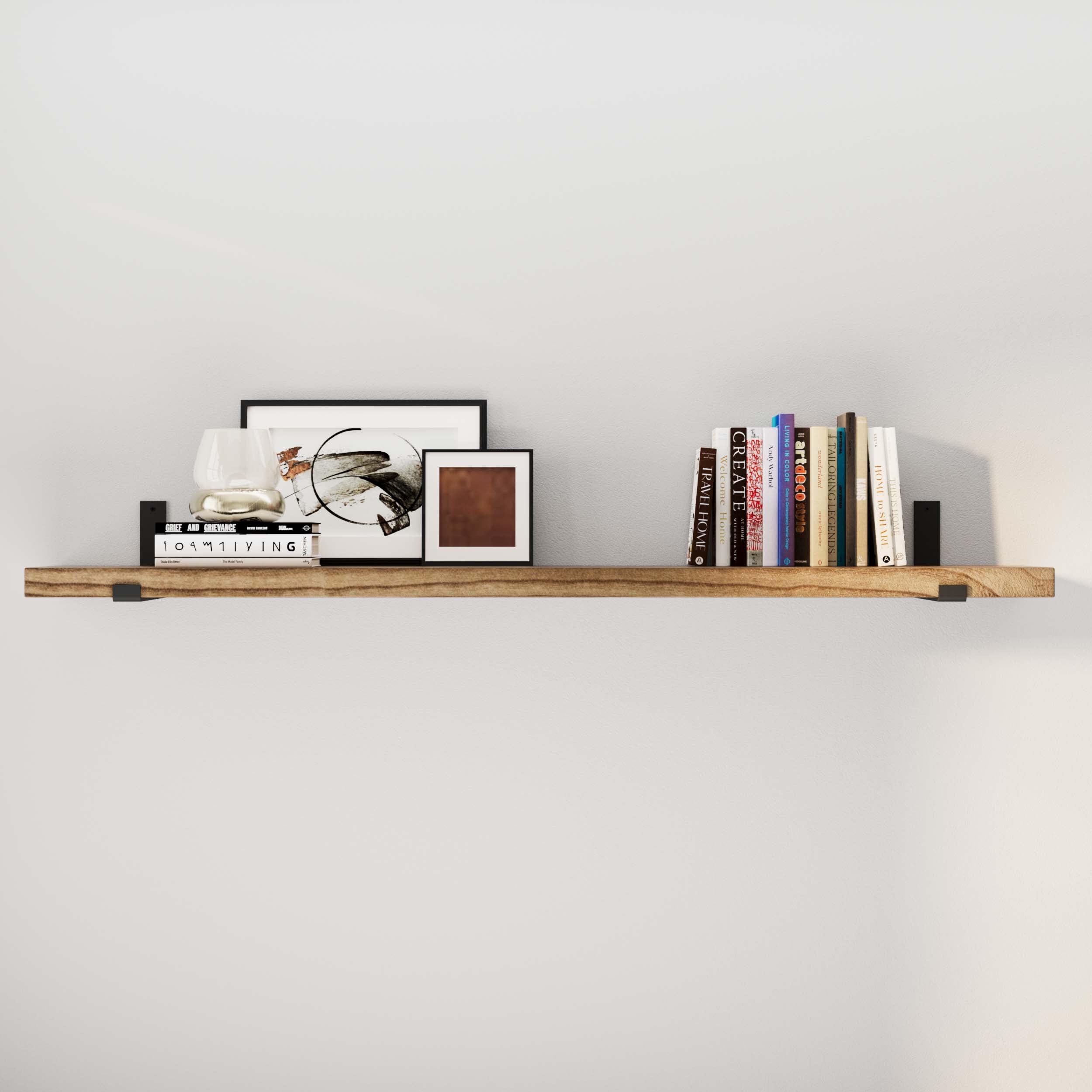 60'' hanging shelf displaying books, art, and a decorative beetle.