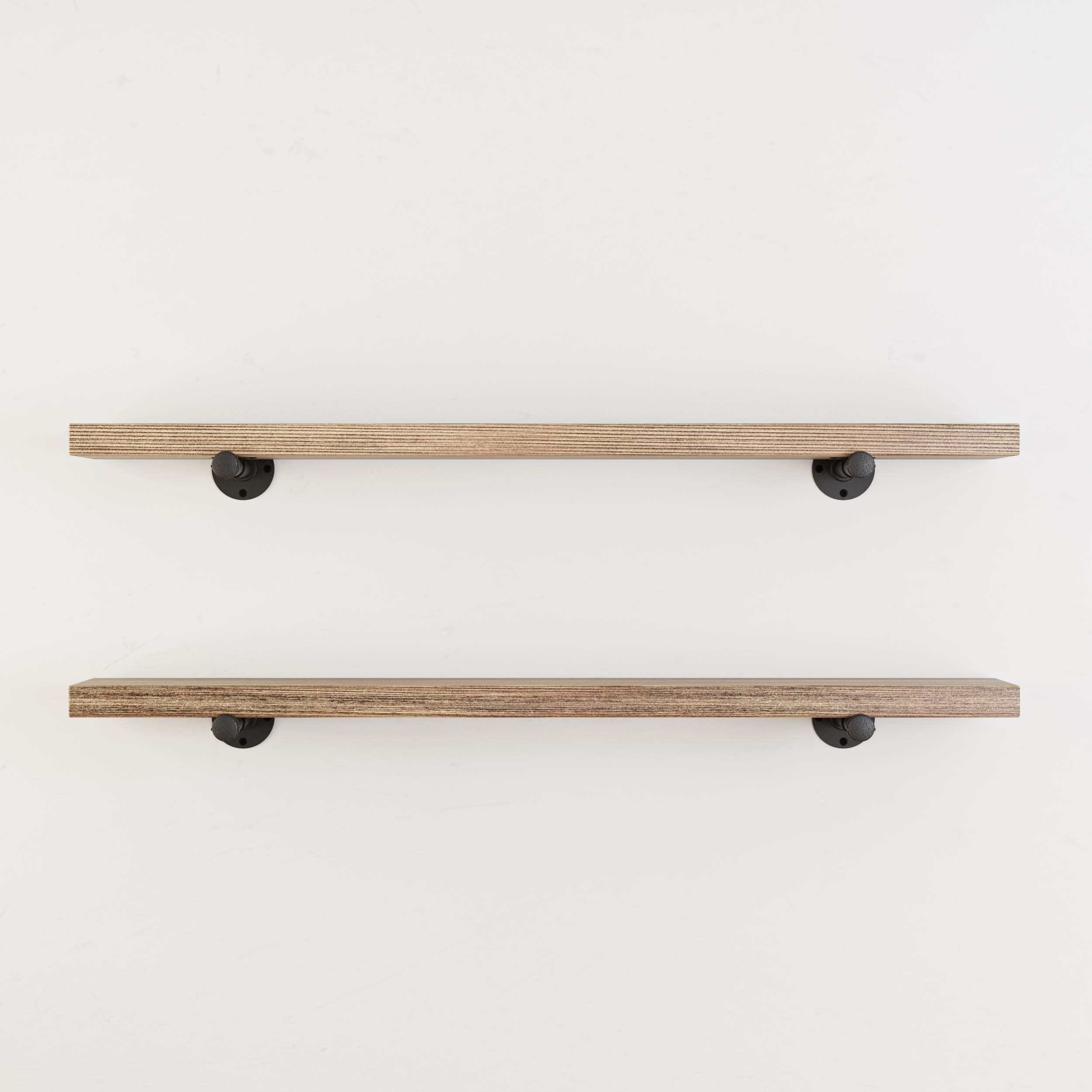 A minimalistic view of two wall-mounted hanging shelves, again with the rustic wooden finish and black metal brackets, highlighting the installation and the style of the brackets.