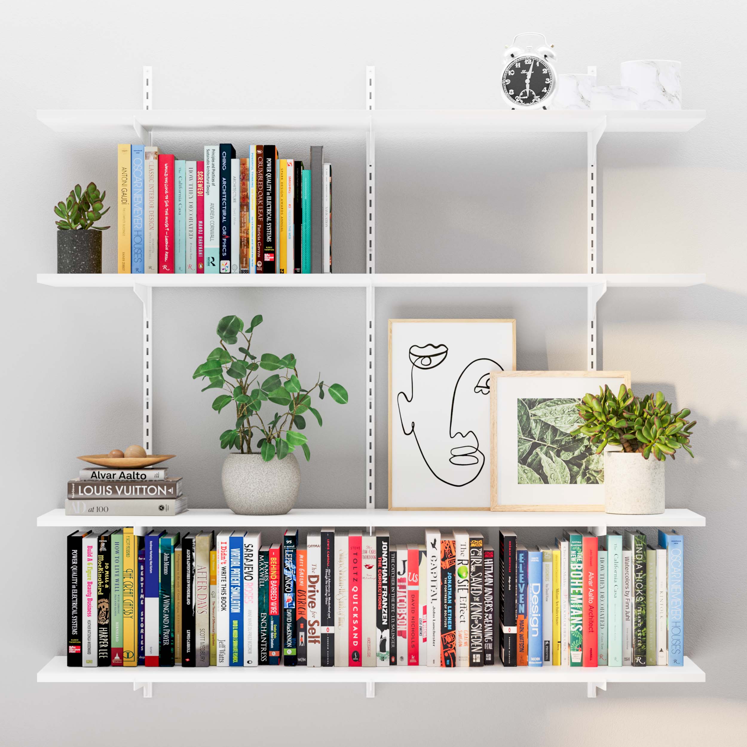 White shelves organized with books, plants, and line-art, creating a serene workspace.