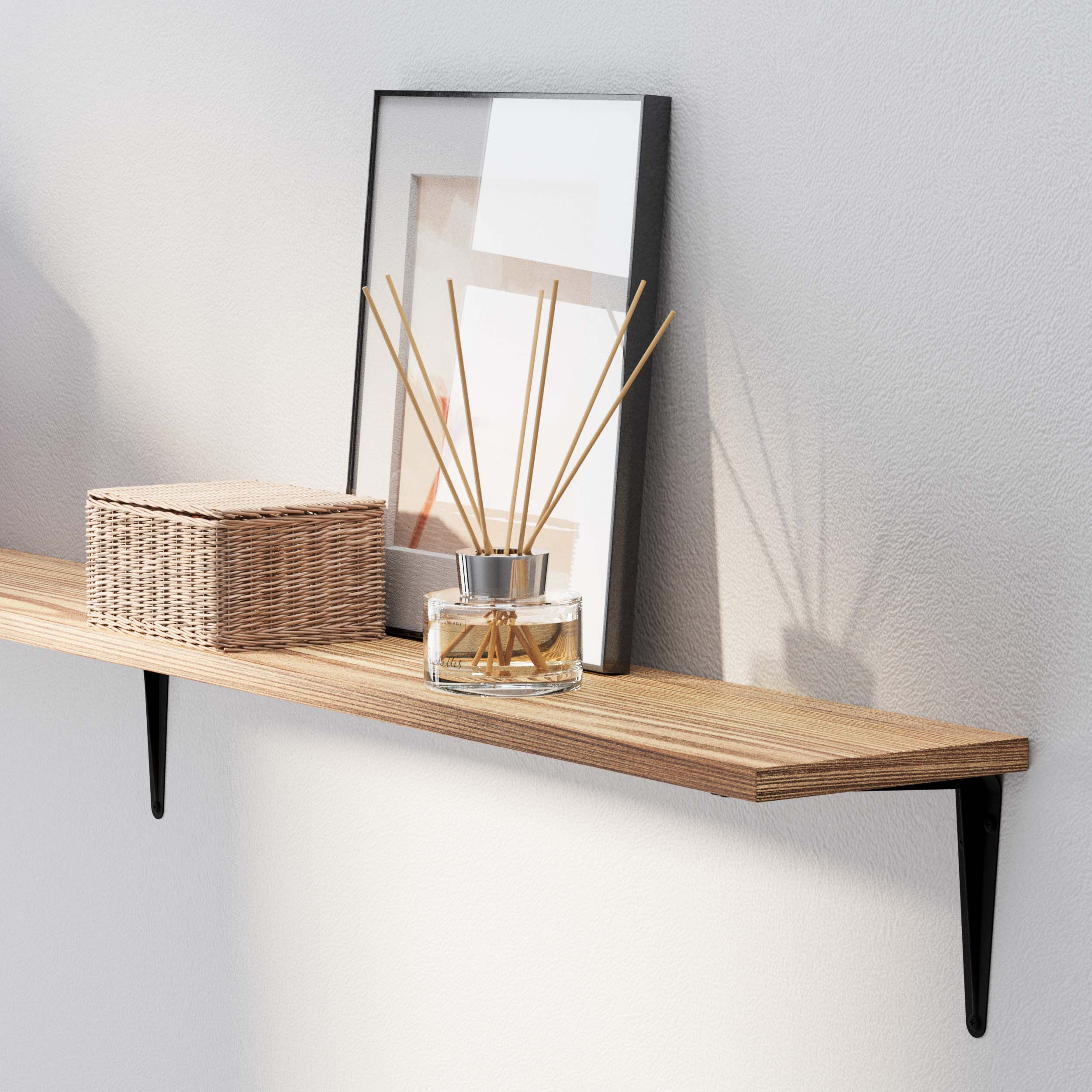 Burnt pantry shelf with a framed picture, a wicker basket, and a glass scent diffuser creating a serene vibe.