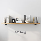 A 60 inch wood shelf styled with candles, books, and bowls, ideal for living or dining spaces.