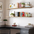 Two long storage shelves above a desk, designed with office essentials, plants, and books, providing practicality and a clean, professional ambiance.