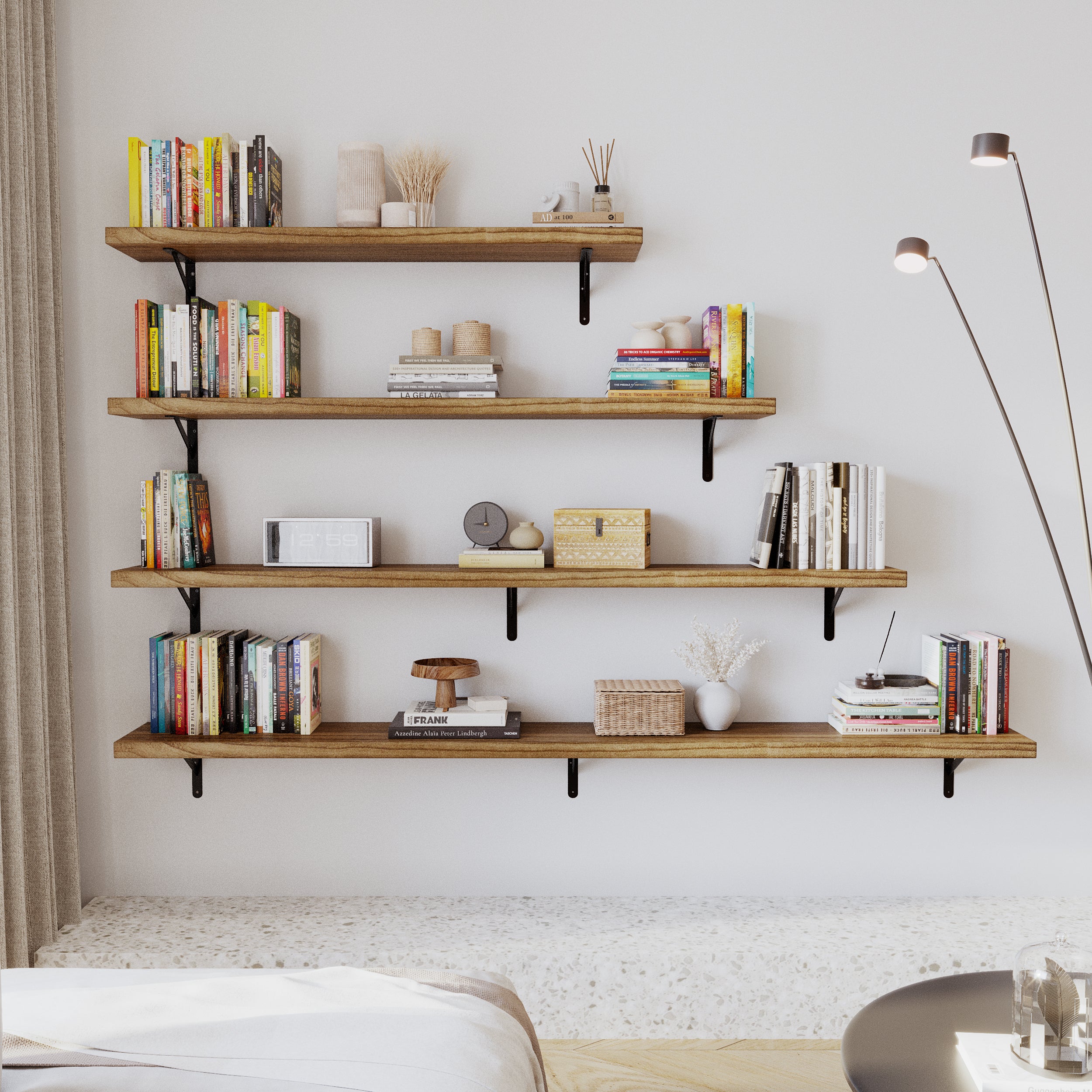 Rustic shelving arrangement displaying books, decor, and storage baskets, styled with black brackets. Perfect for a minimalist or modern living space.