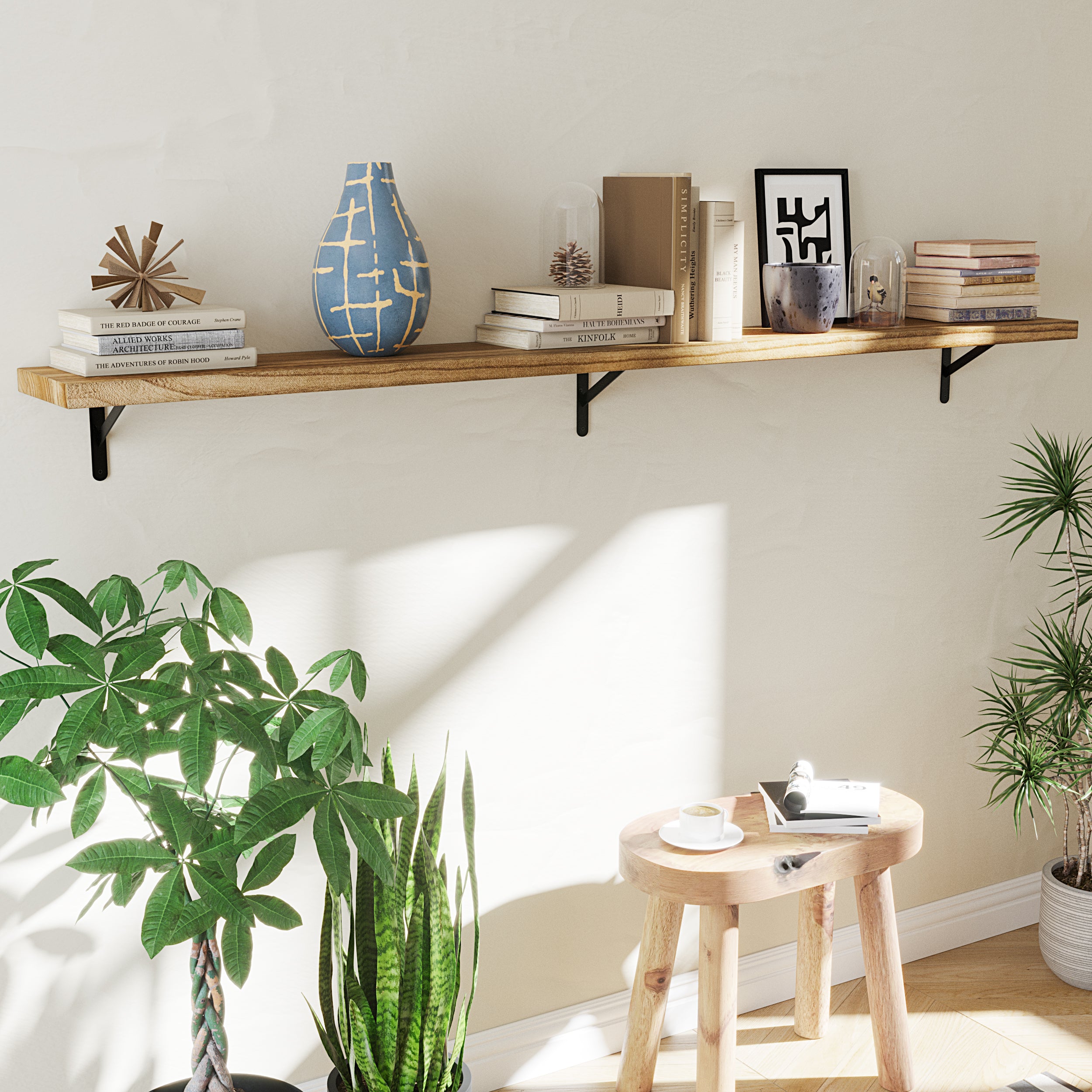 A bright 84 inch long boho shelf setup, styled with books, ceramics, and plants, against a neutral wall with sunlight streaming in, creating a cozy reading nook.