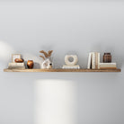 Solid wood floating shelf with hidden bracket styled with modern earthy décor, including ceramic vases, books, and dried botanicals. The neutral palette and soft lighting create a calm, elegant atmosphere for home or office display.