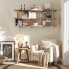 Living room with a white armchair, hanging wall book shelves, and decorative items.