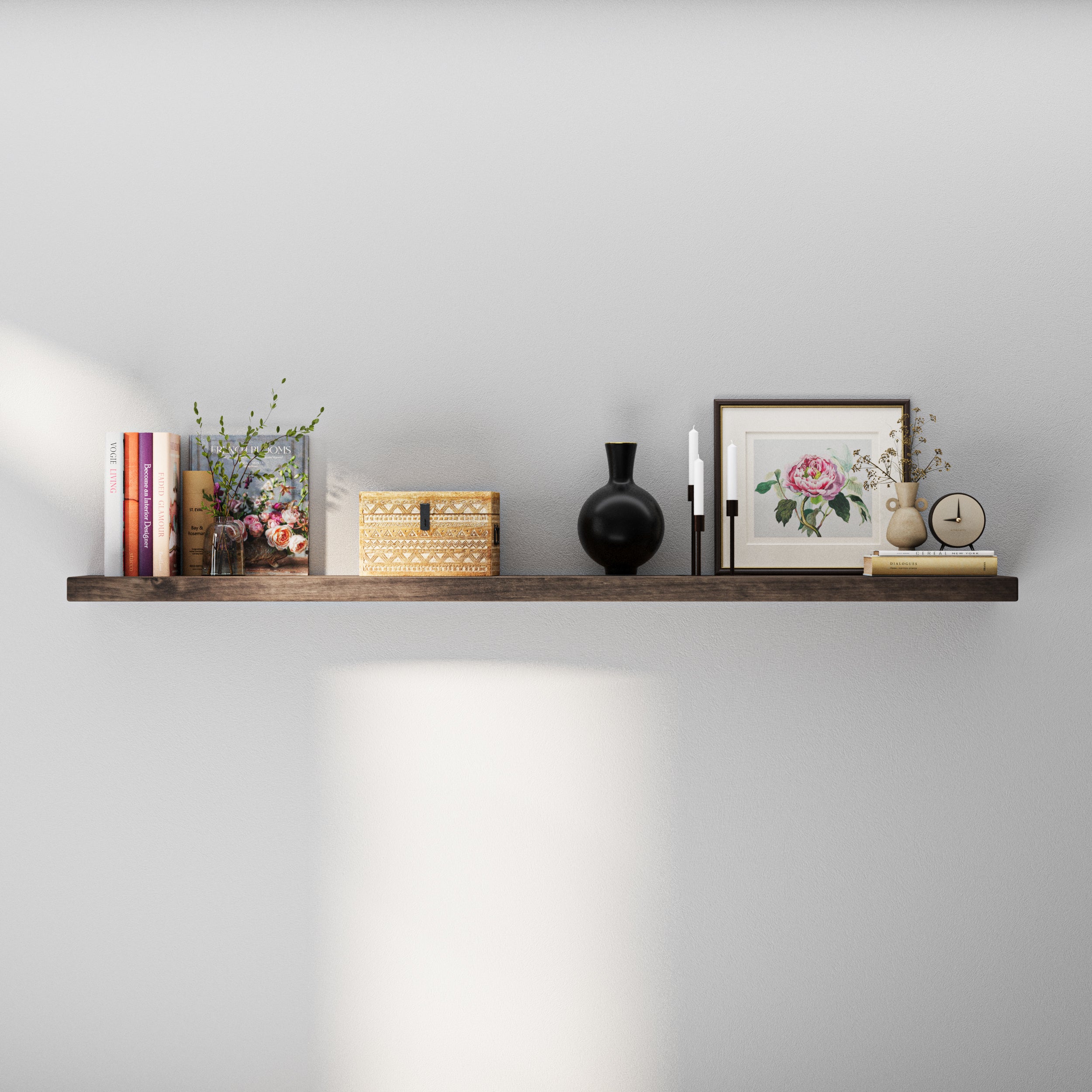 A 60 inch long hidden bracket shelf with books, a decorative vase, a black sculpture, and a floral framed print—styled in a soft, neutral-toned setting that highlights modern elegance.