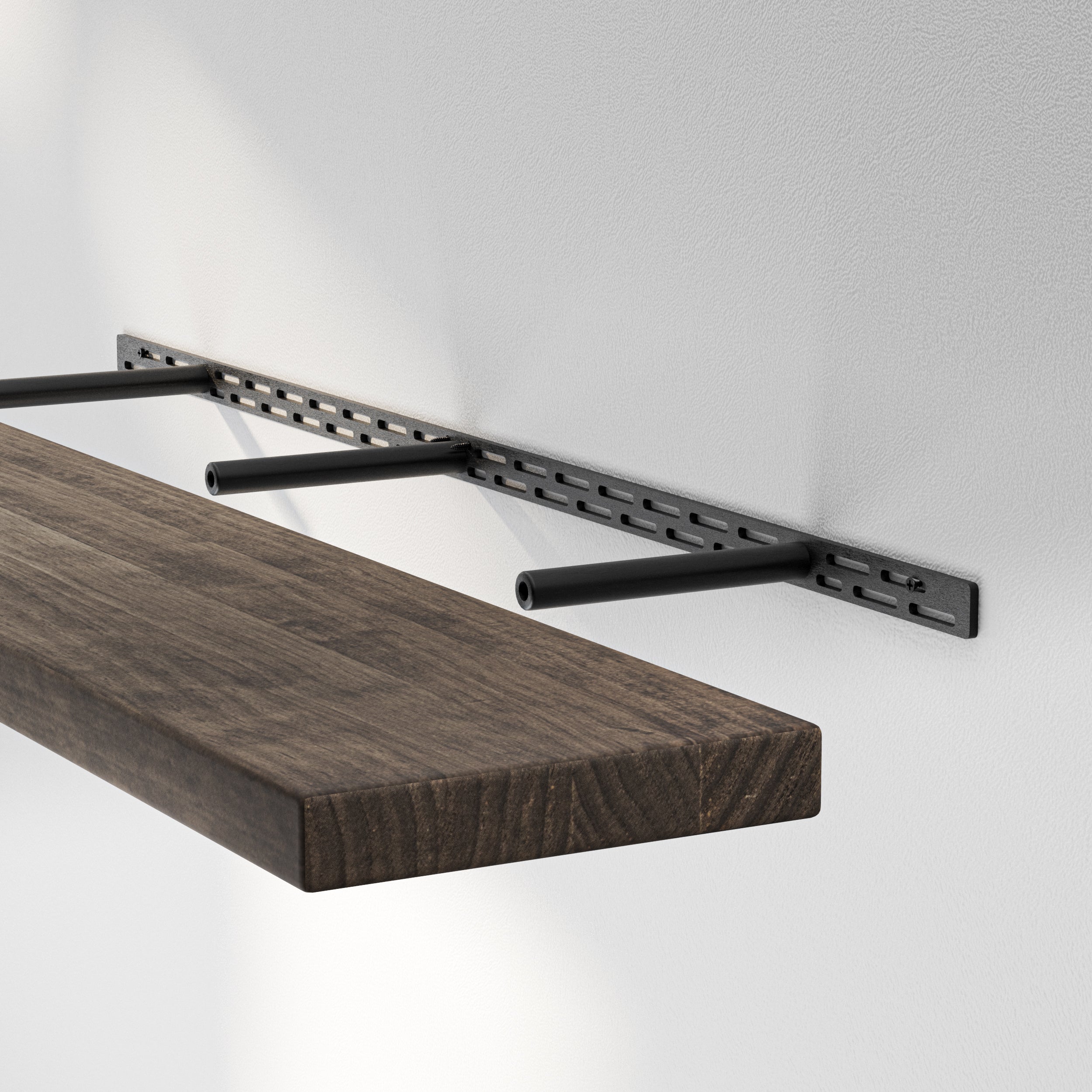 A floating shelf with hidden bracket, revealing the metal mounting hardware embedded into the wall for a sleek, concealed look.