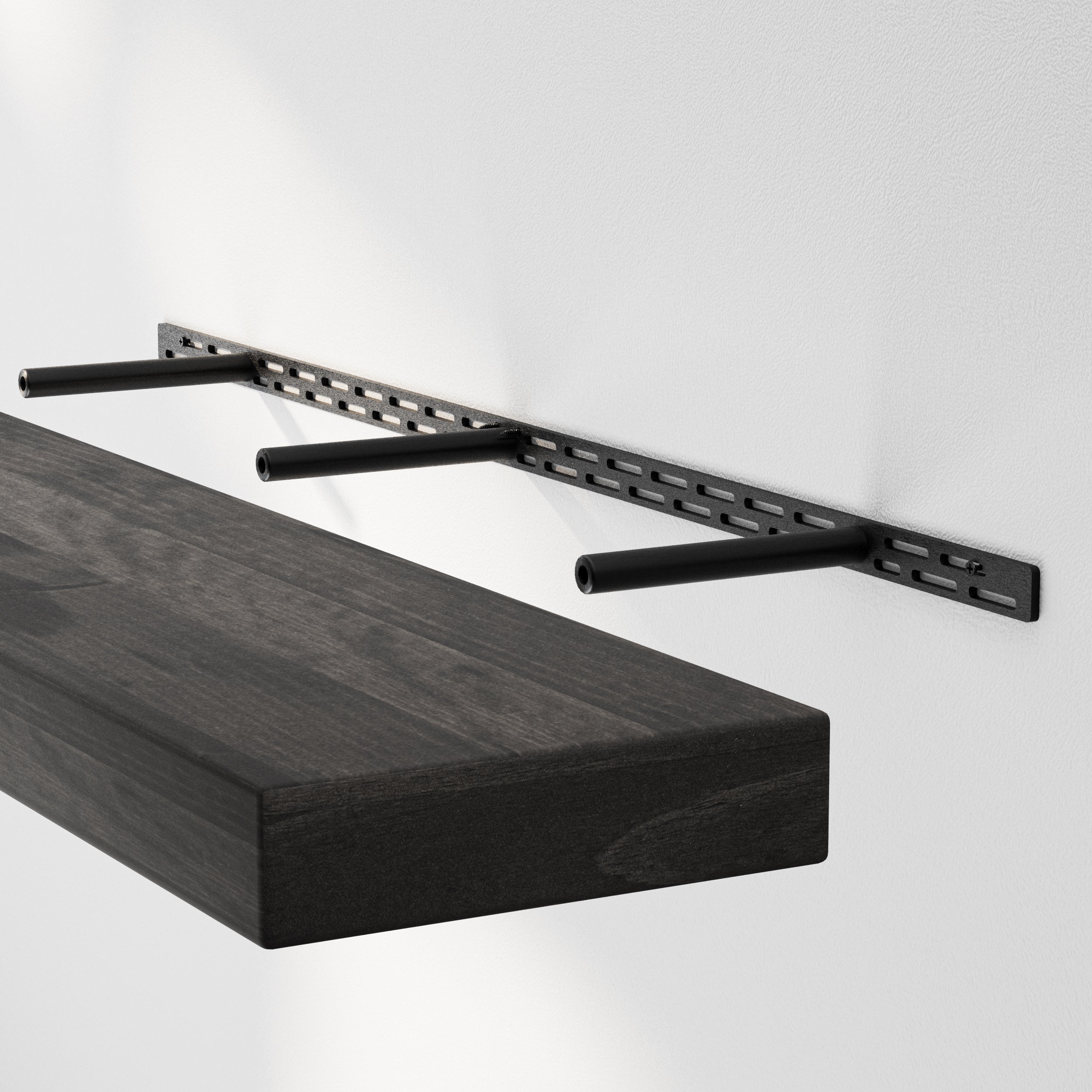 A floating shelf installation shows the sturdy hidden bracket system supporting a thick espresso-finished wood board, highlighting its durable structure.