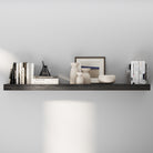 A 60 inch long wooden floating shelf in a rich ebony finish, decorated with neutral-toned vases, a framed print, and books. Minimalist yet warm design ideal for modern living spaces.