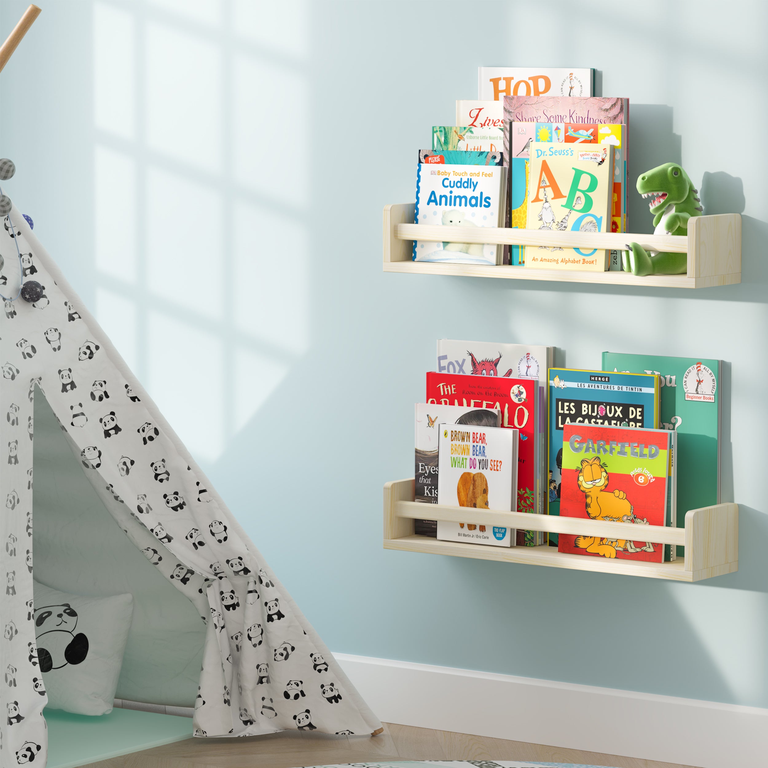 Two natural floating book shelves for kids room filled with children's books, mounted on a light blue wall next to a play tent. The setup creates a cozy and inviting reading nook for children, with plenty of book storage.