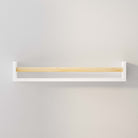 An empty white wall shelf with a natural wood rod mounted on a light gray wall. Its simple and elegant design makes it versatile for various uses, from holding books to displaying decorative items.