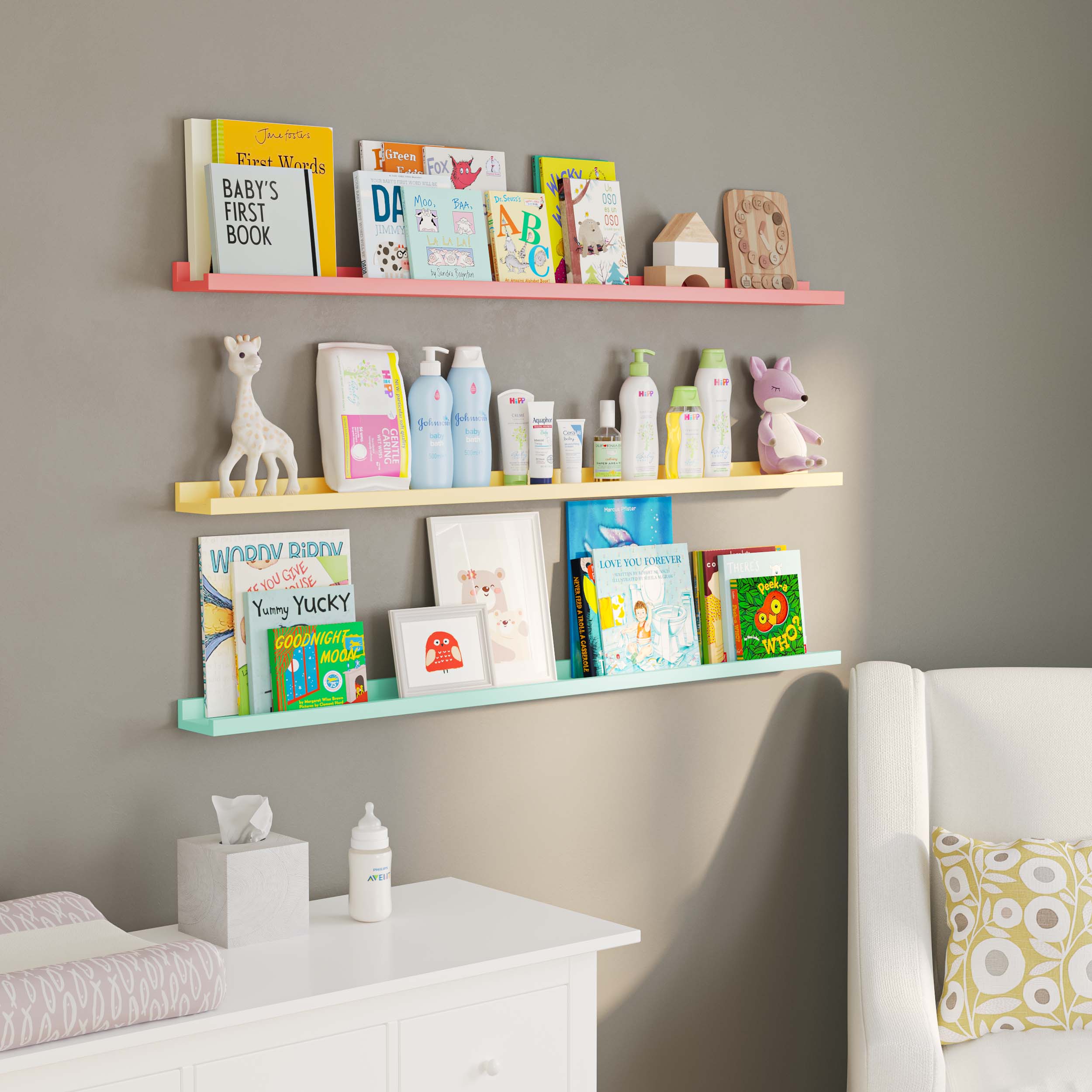  a nursery room with three pastel-colored wall-mounted shelves (pink, yellow, and mint green). The shelves hold a combination of children's books, baby care products, and decor items, such as a giraffe figurine and framed artwork, creating a soothing and well-organized space for a baby.