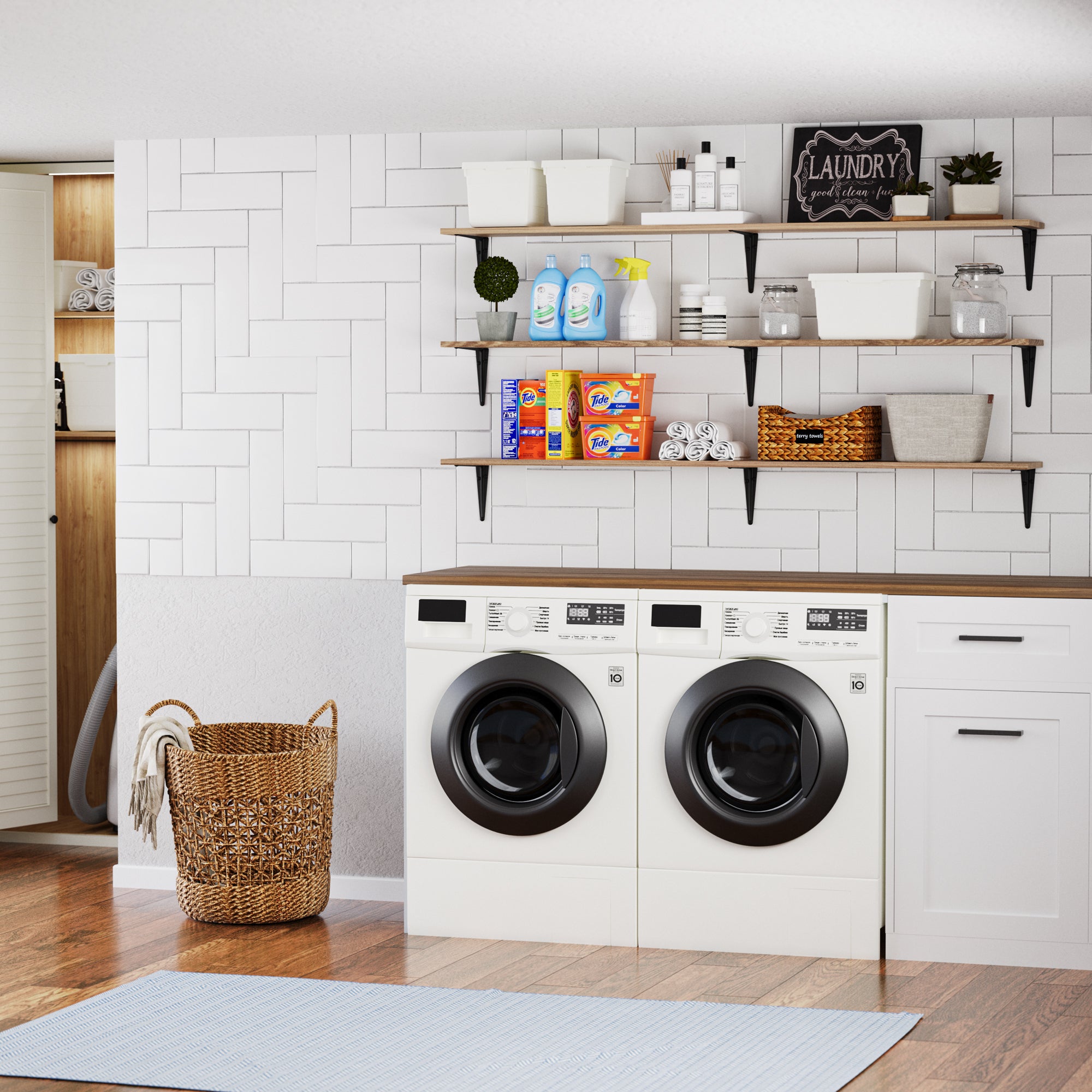 Pantry shelves above a washer-dryer set, holding detergent, towels, and storage bins—adding vertical storage and charm to a crisp, clean laundry room.