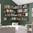 A dramatic wall-to-wall corner library with multiple long rustic shelves, fully stacked with books. Ideal for avid readers or a stylish study space.