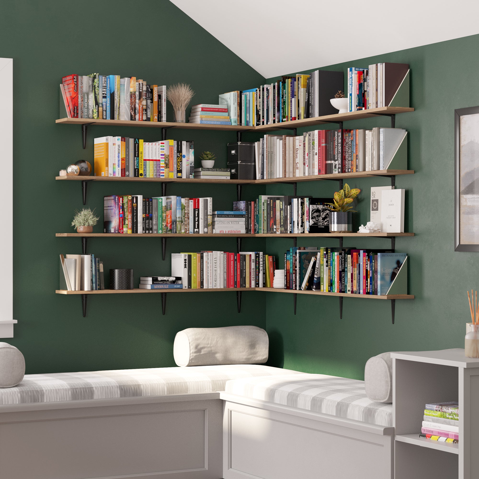 Extensive arrangement of floating shelves filled with a vibrant collection of books in a green-walled room.