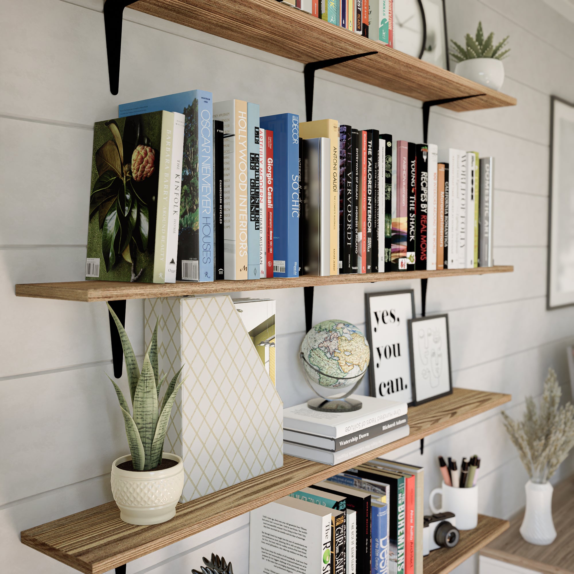 Home office with wall-mounted shelves supported by black metal brackets for books and decor.