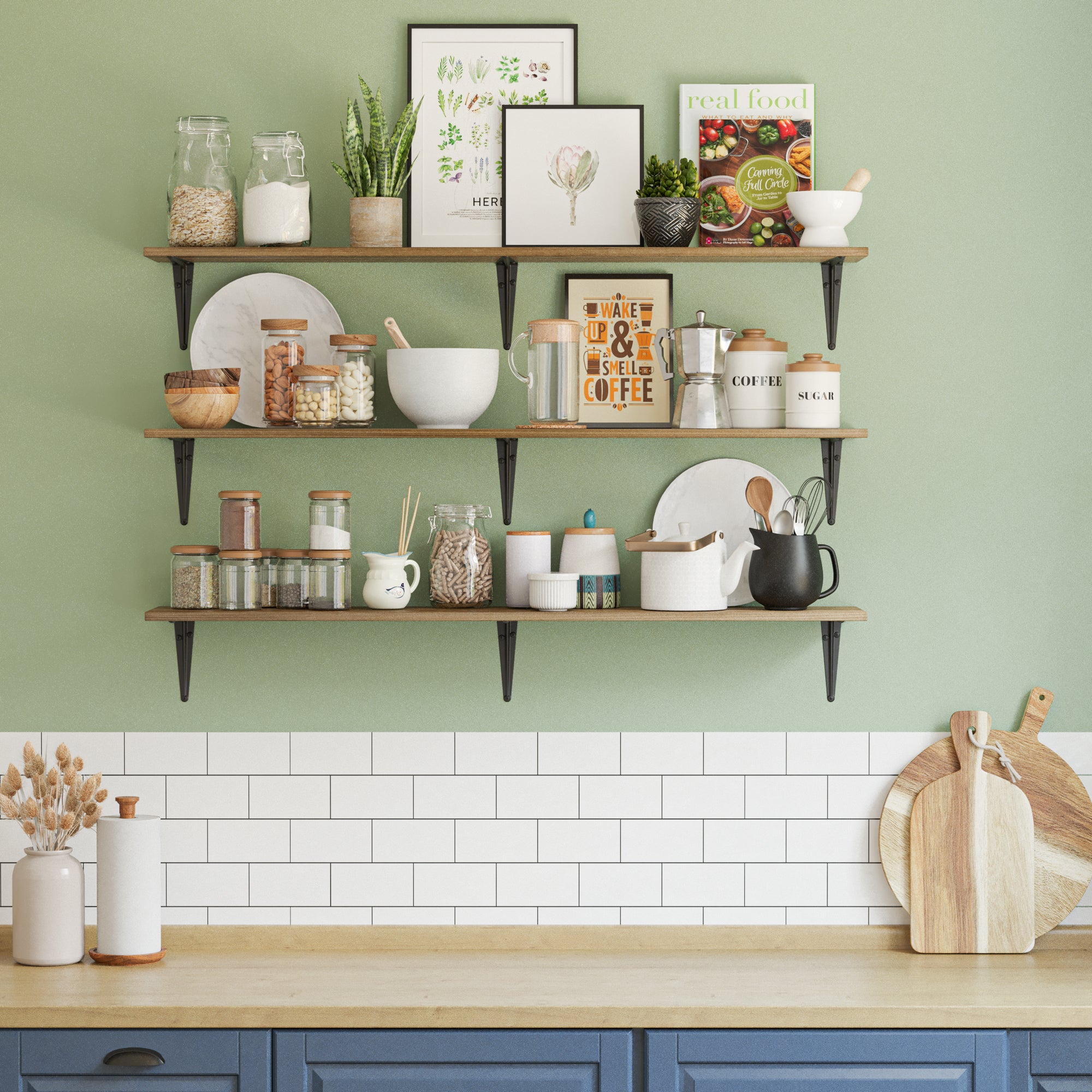 Triple kitchen shelves on a green kitchen wall, stocked with jars, herbs, cookbooks, and kitchenware—perfect for storage and rustic kitchen decor.