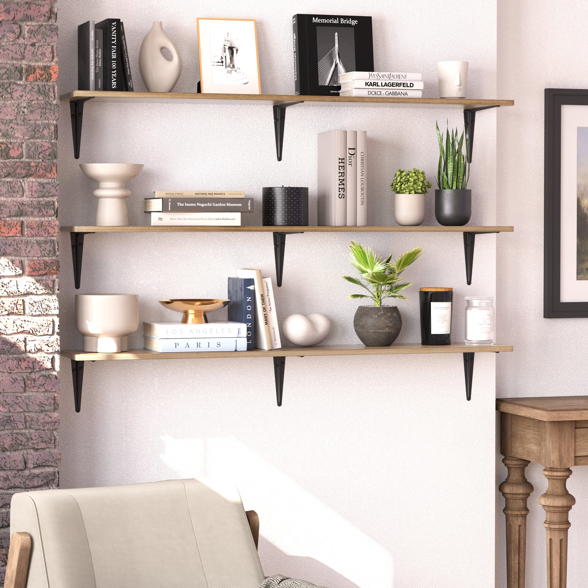 Three floating shelves stacked vertically, styled with neutral décor, books, vases, and plants, blending rustic and contemporary elements.