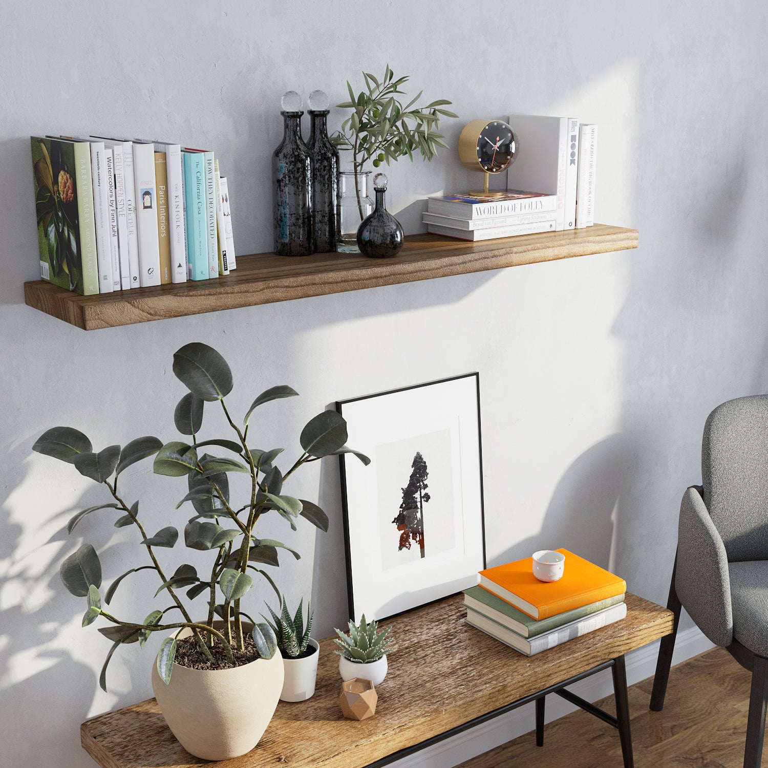 Floating wall shelf is decorated with colorful books, black glass vases, and greenery. Styled above a rustic bench and surrounded by plants, it creates a fresh and organic look for a serene corner.