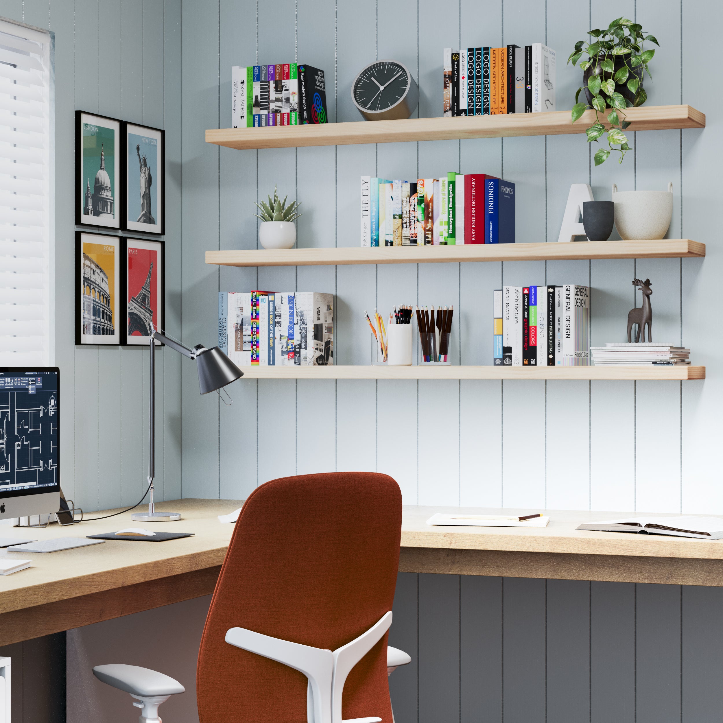 Set against blue panel walls, three natural-finish floating office shelves organize books, stationery, and decor above a tidy desk, enhancing this home office with clean lines and soft tones.