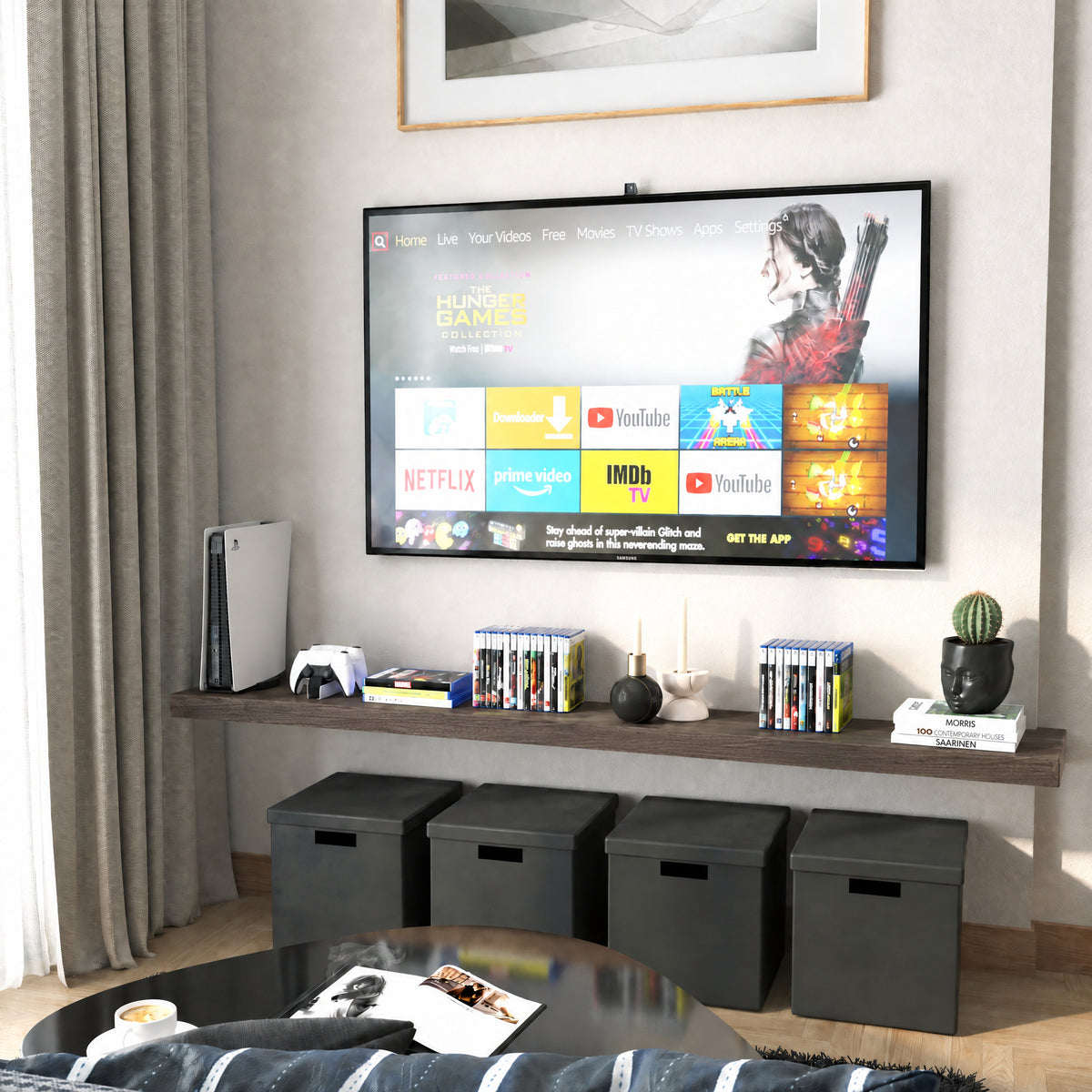 A 72 inch long floating wall shelf with invisible bracket in a rich dark walnut finish below a wall-mounted TV holds media items and decorative objects. Black cube storage and neutral tones complete the entertainment nook.