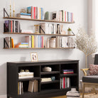 60 inch rustic shelves mounted above a dark console, showcasing books and decor items in a cozy, elegant living room setup.